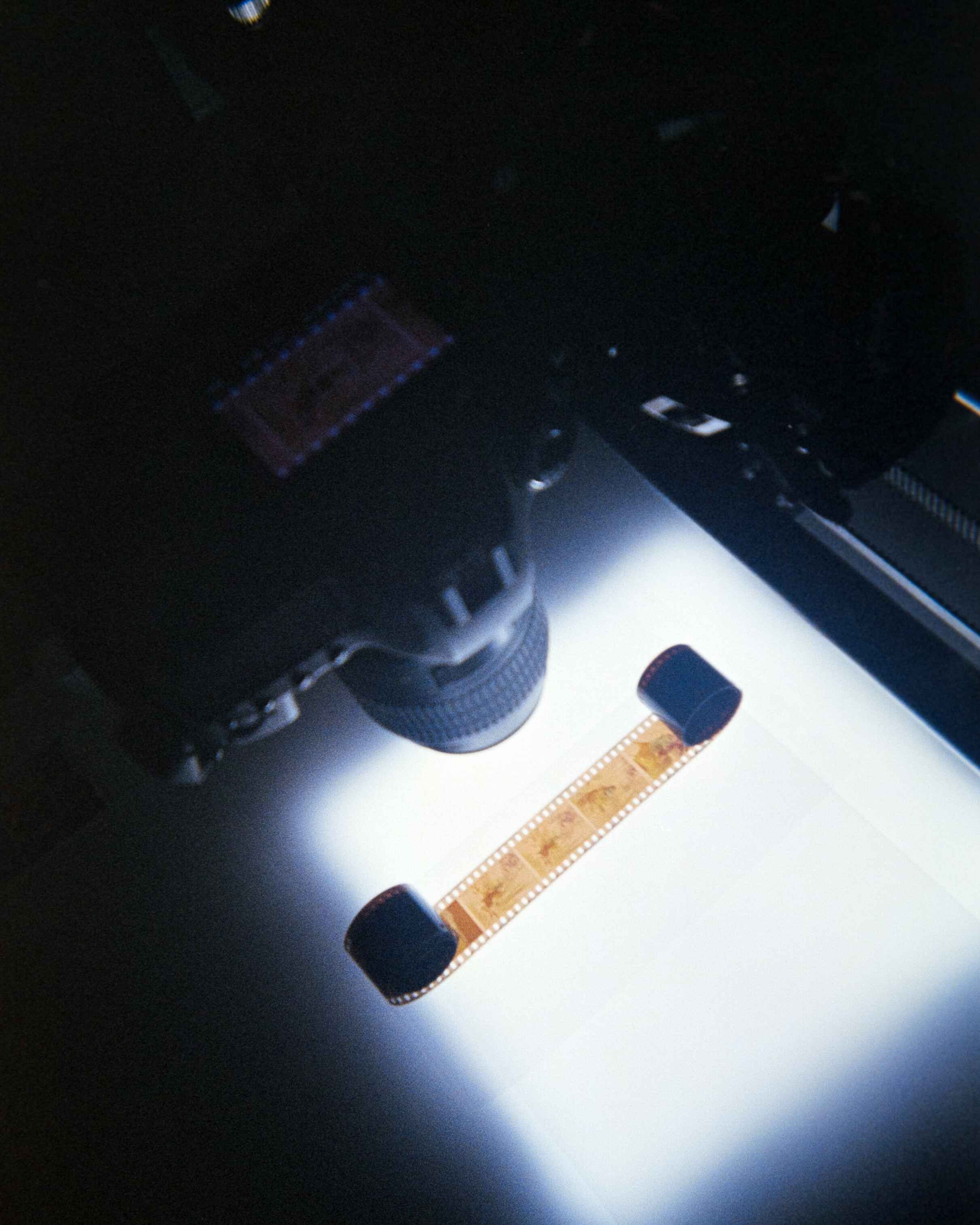 An image shot on 35mm Film of what Josie sees when she scans her 35mm Film, her setup is a DSLR, film holder, and a light box.