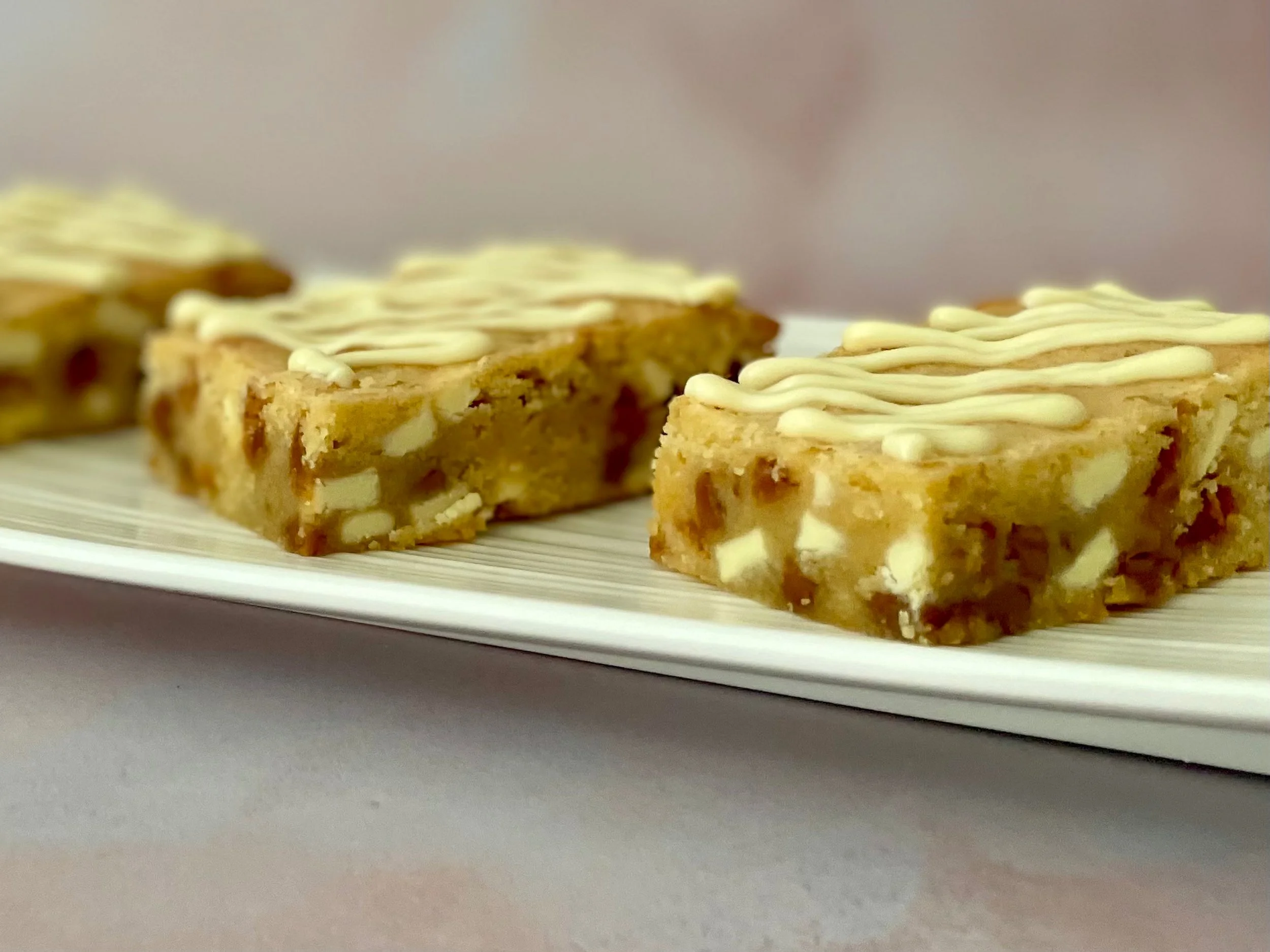 Golden brown butter blondies with creamy white chocolate chips and fudge pieces