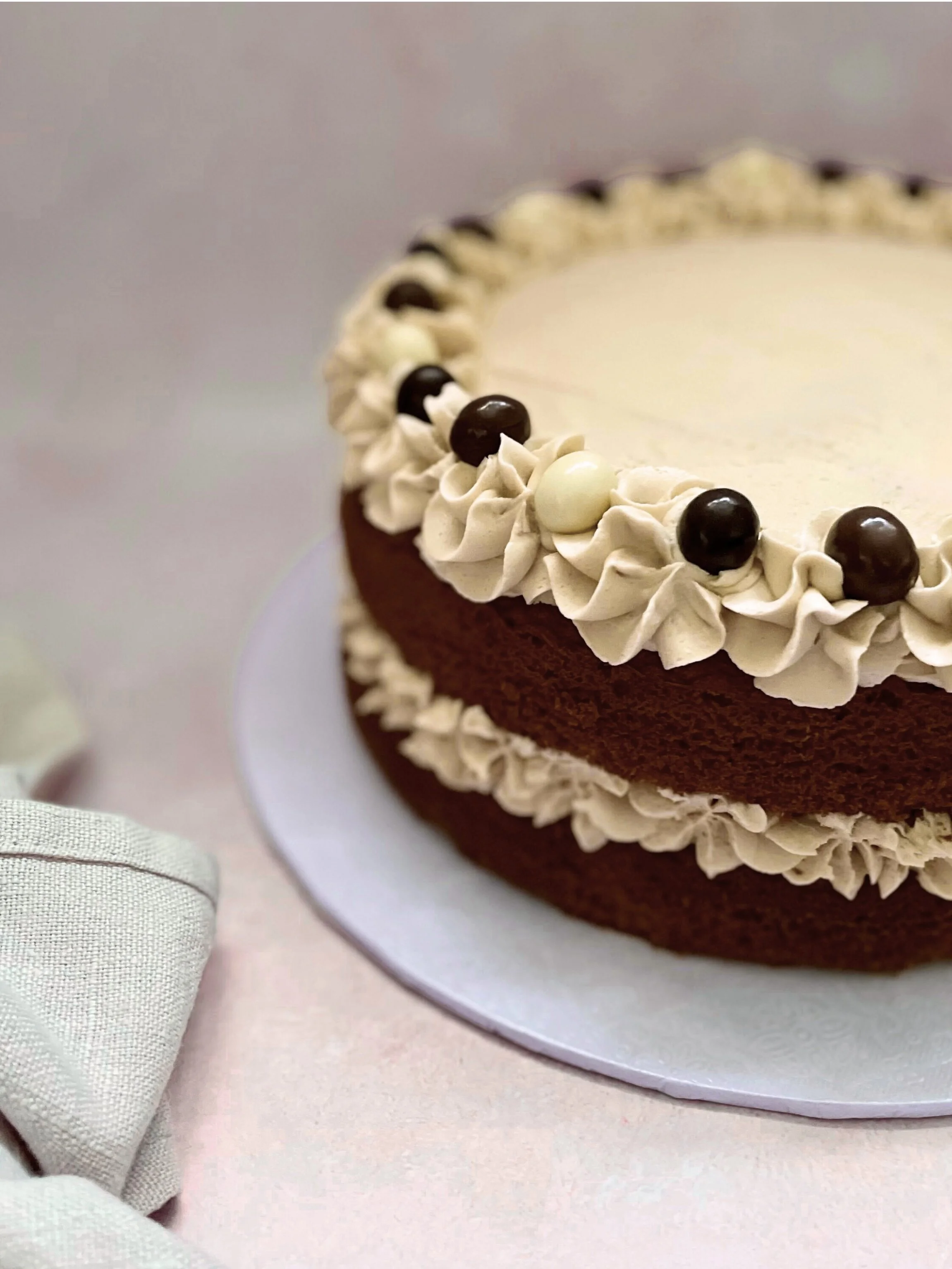 Coffee cake with Italian meringue buttercream and chocolate espresso beans by Baked by Me for You in Horsforth