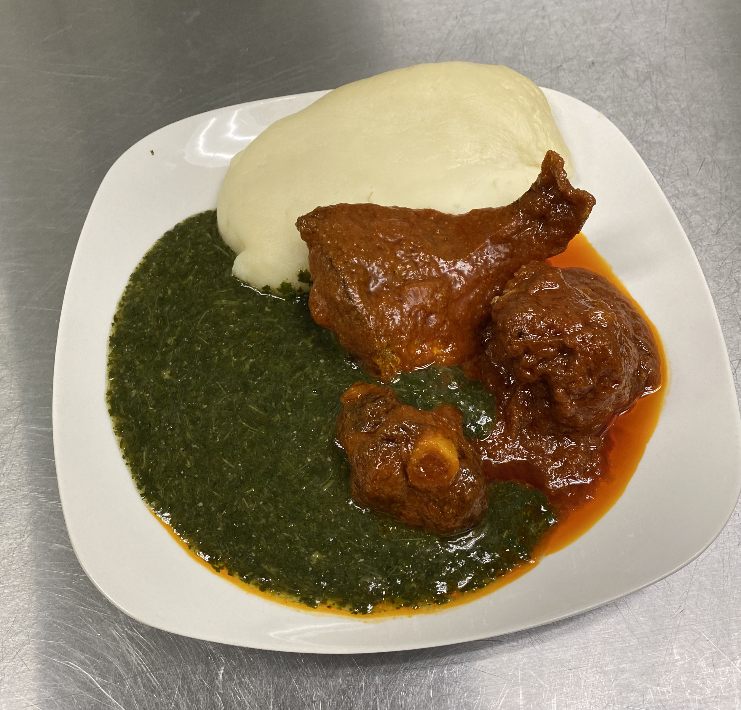 Pounded Yam w/ Ewedu, Fish & Goat
