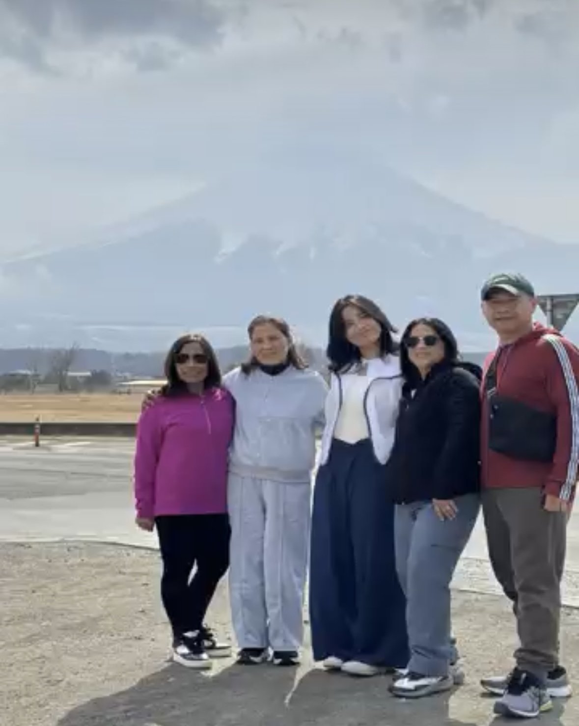 Family picture with a background of Mt. Fuji near Oshino Hakai.