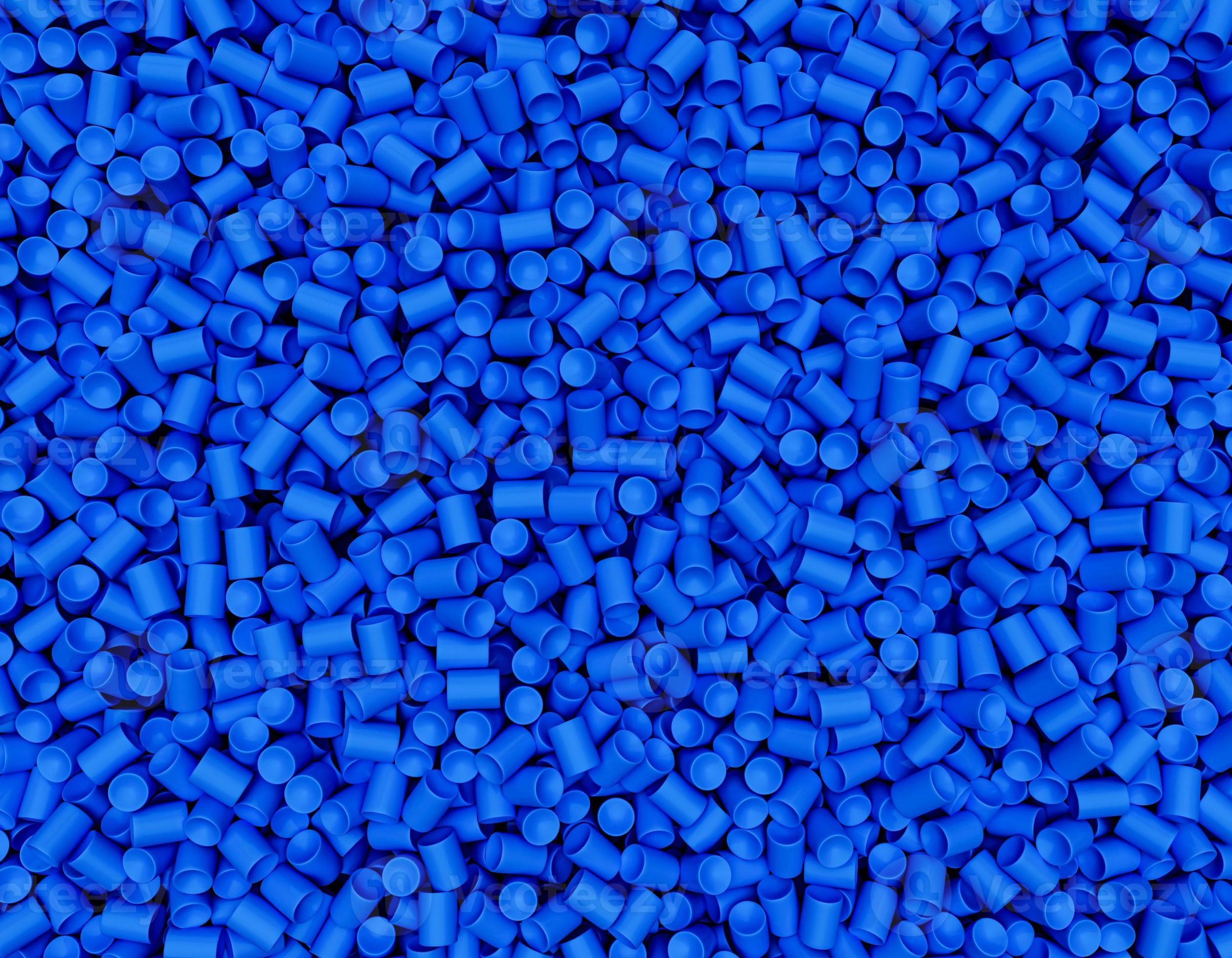 A large number of small blue plastic pellets densely packed together.
