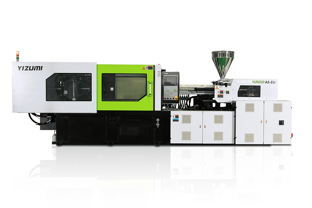Industrial injection molding machine with white, green, and black components, labeled YIZUMI and UN220 A5-EU.