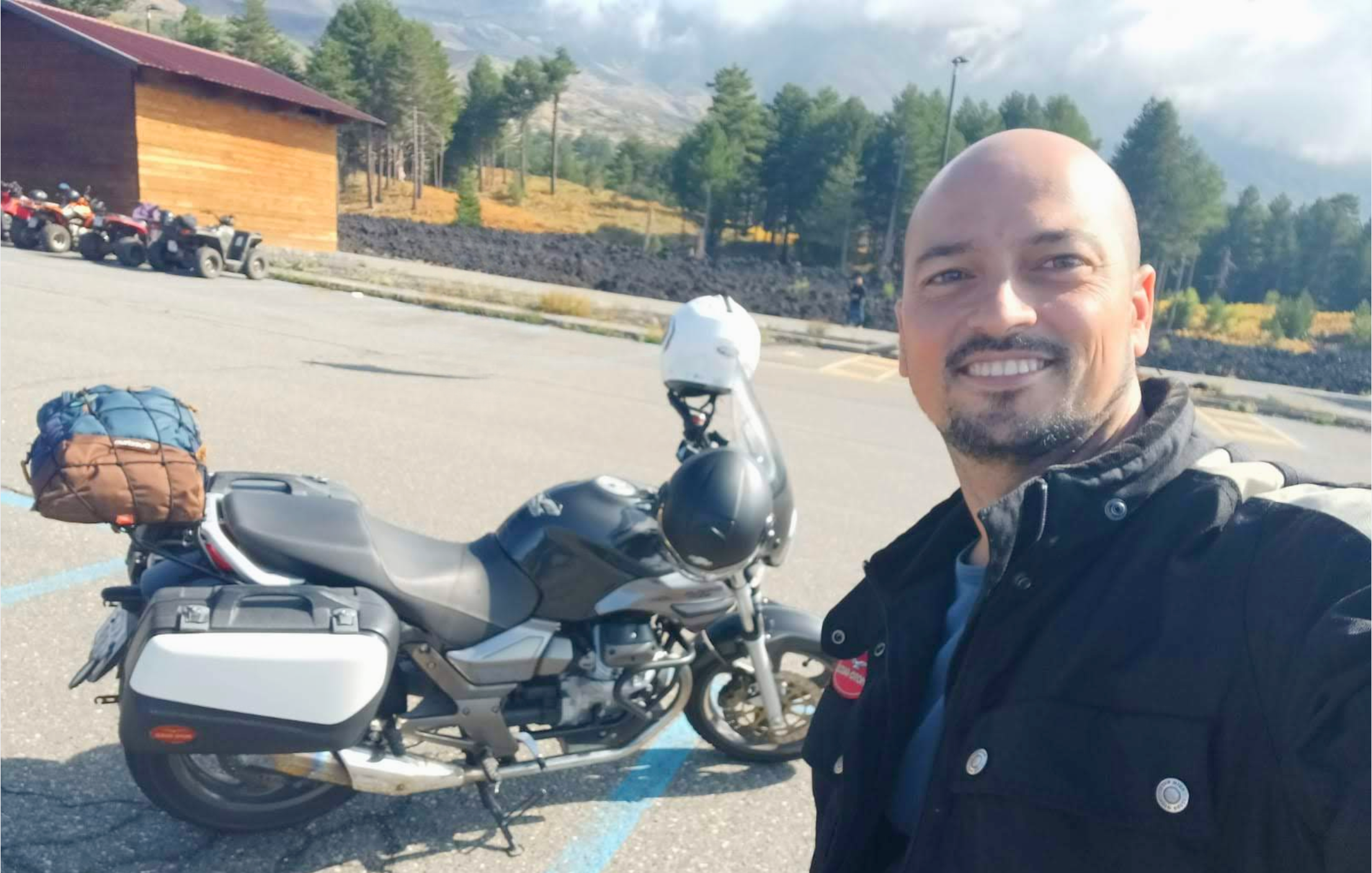 Steve Muscat Azzopardi smiling with his motorcycle helmet removed, illustrating the importance of bringing the human self to the leadership role.