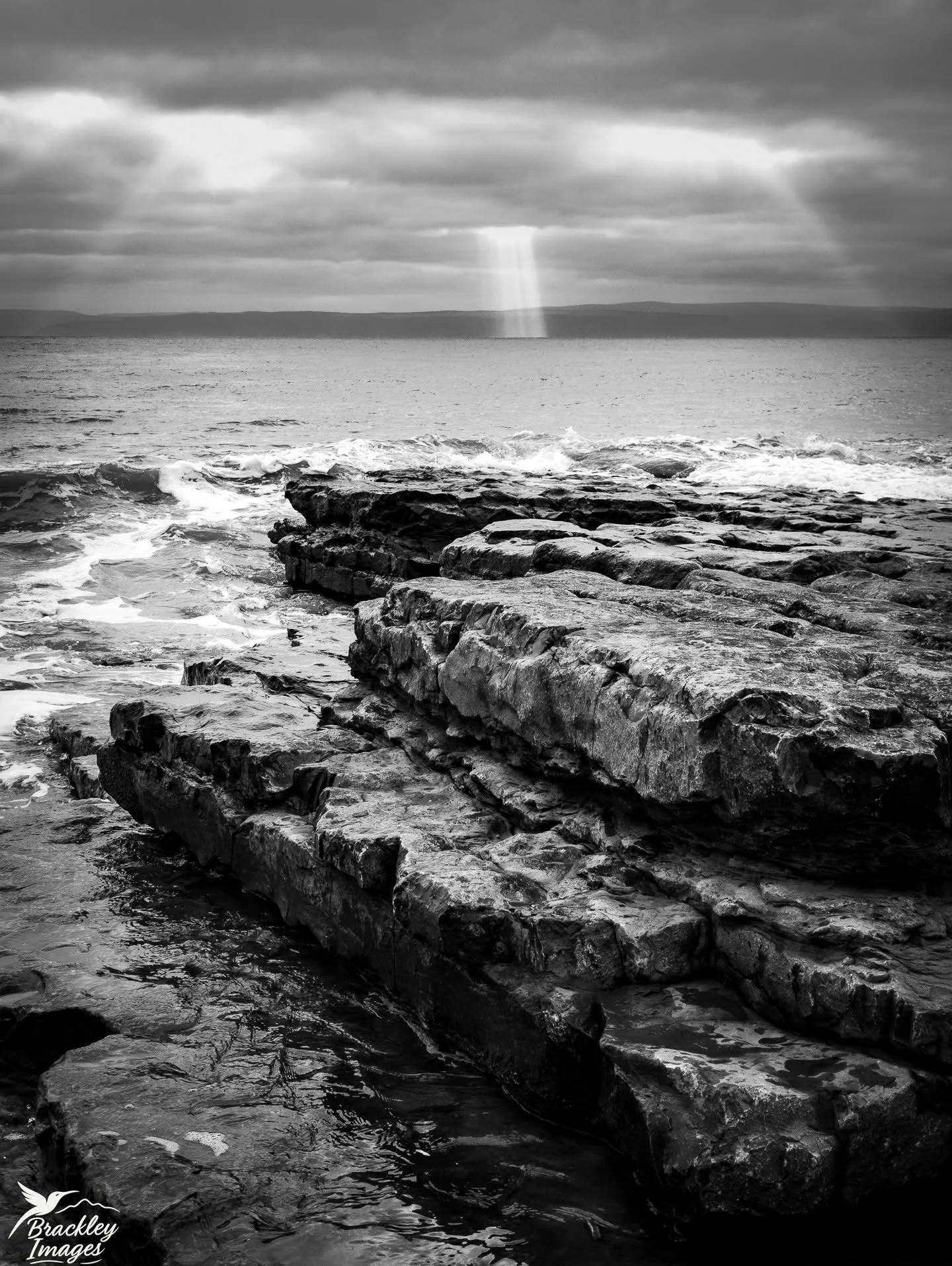 Black and white works best to highlight the beams of light breaking through the clouds in this scene from Llantwit Major Beach in South Wales, today. 

#beautifulbritain