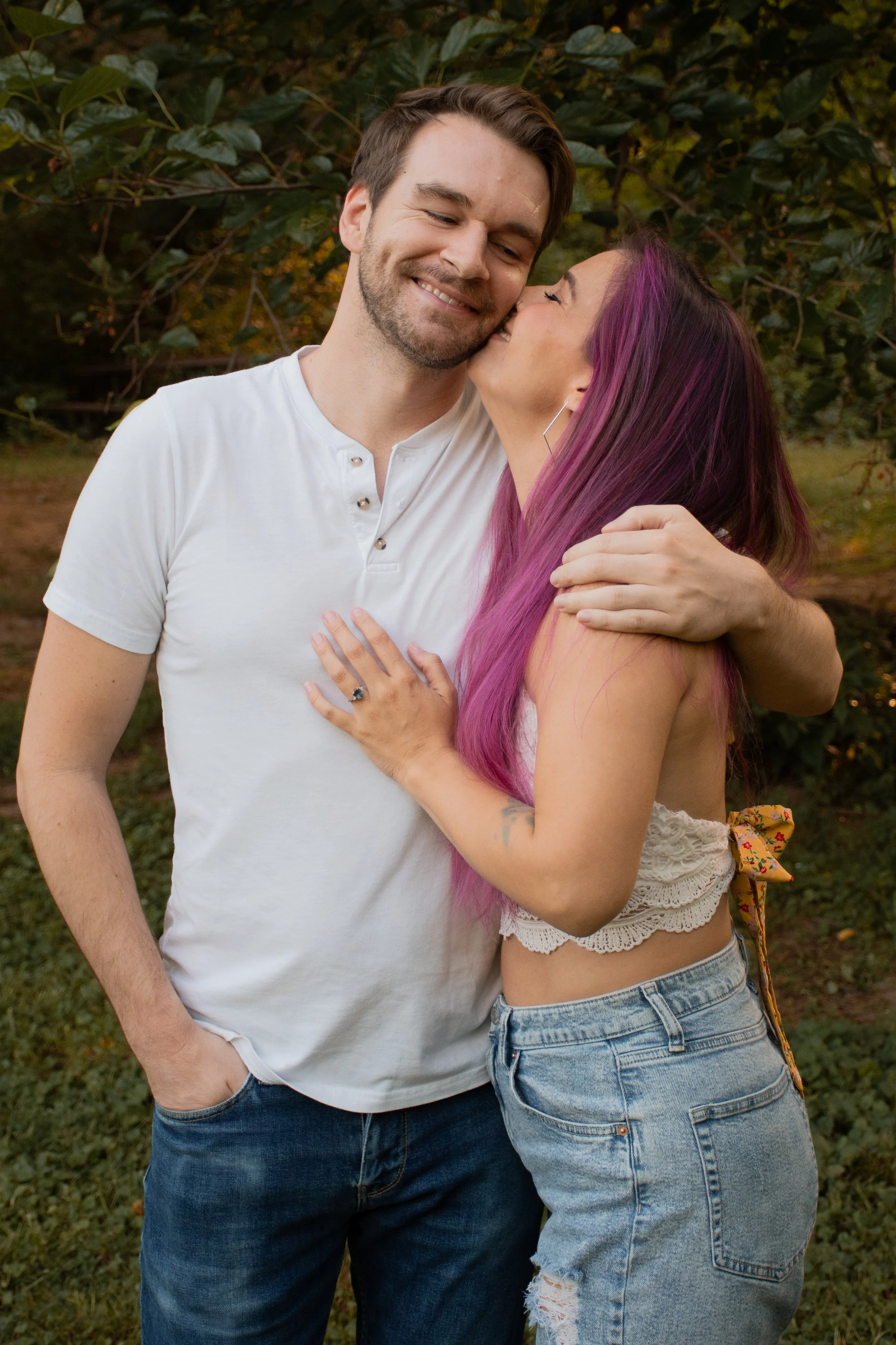 A couple embracing, the woman kissing the man's cheek