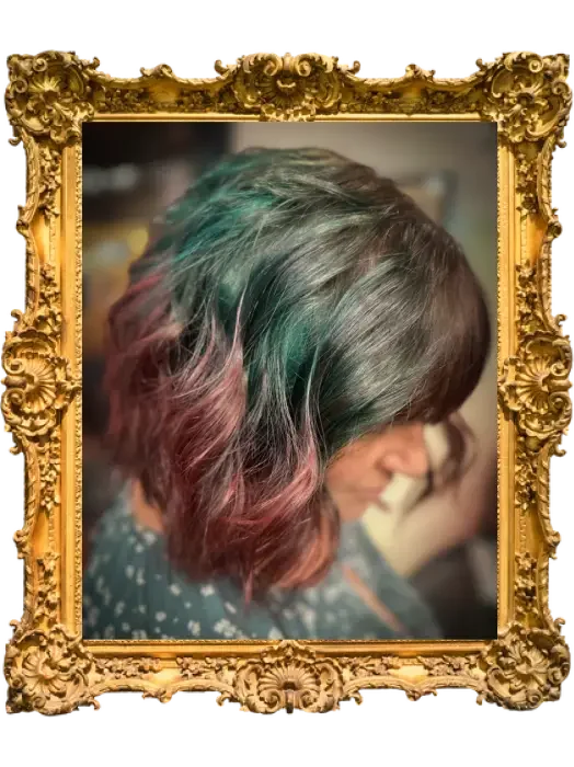 Woman with rainbow-colored wavy hair in shades of green, purple, and pink