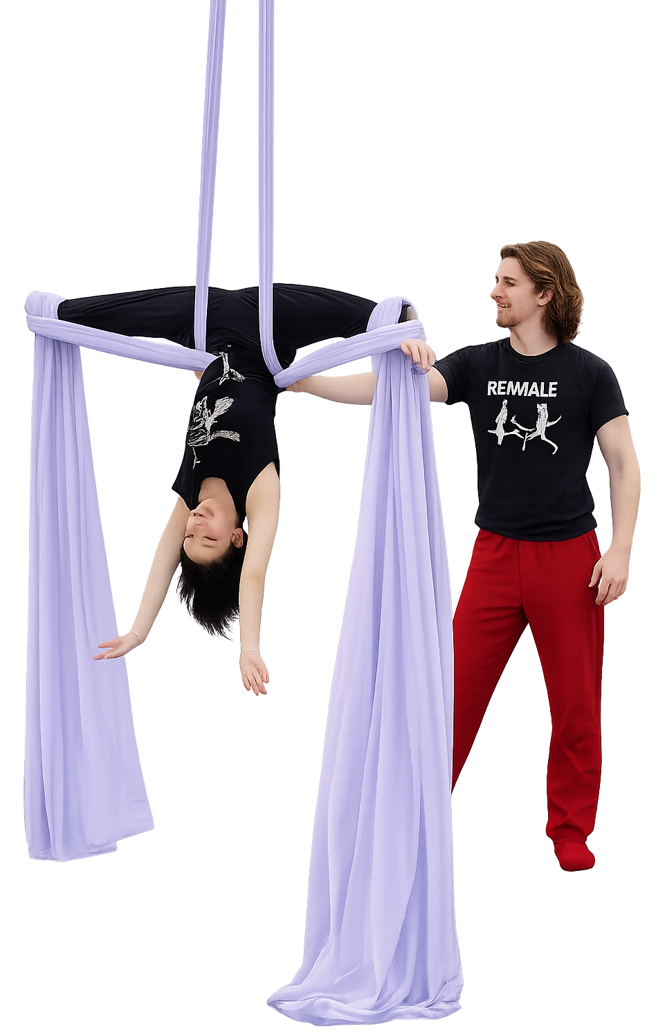 A man and a young girl practicing aerial silk acrobatics; the girl hangs upside down wrapped in purple silk, while the man holds the silk and smiles at her.