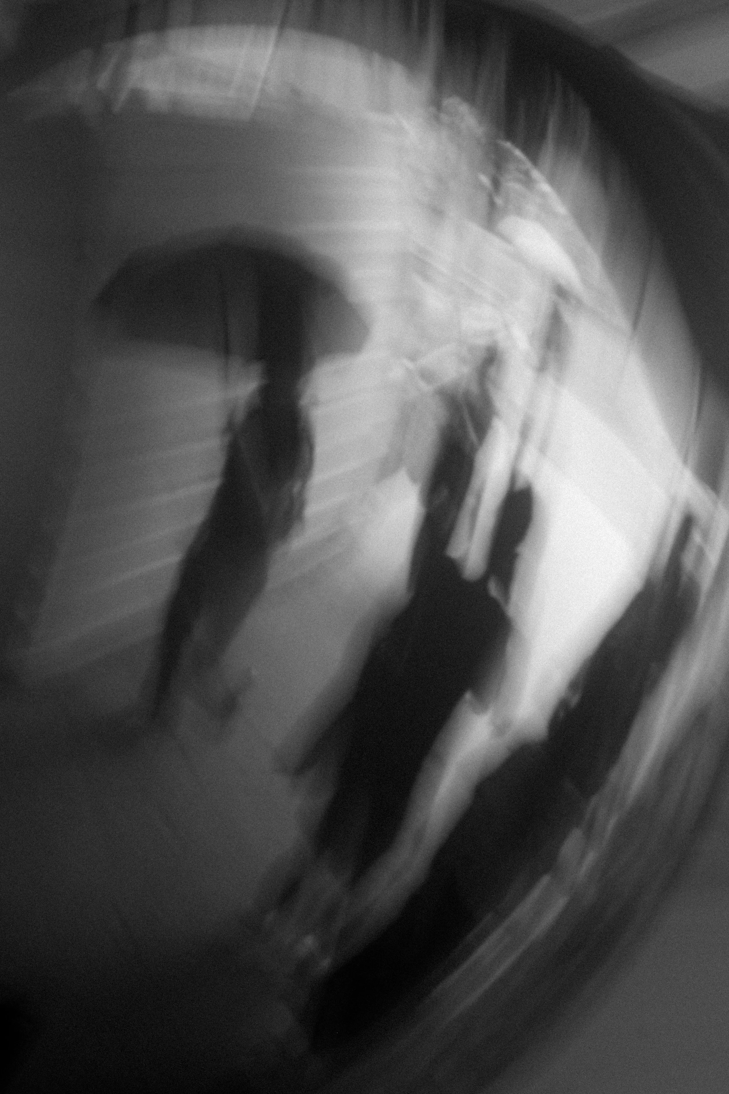 A blurred black and white photo of a staircase with multiple steps.