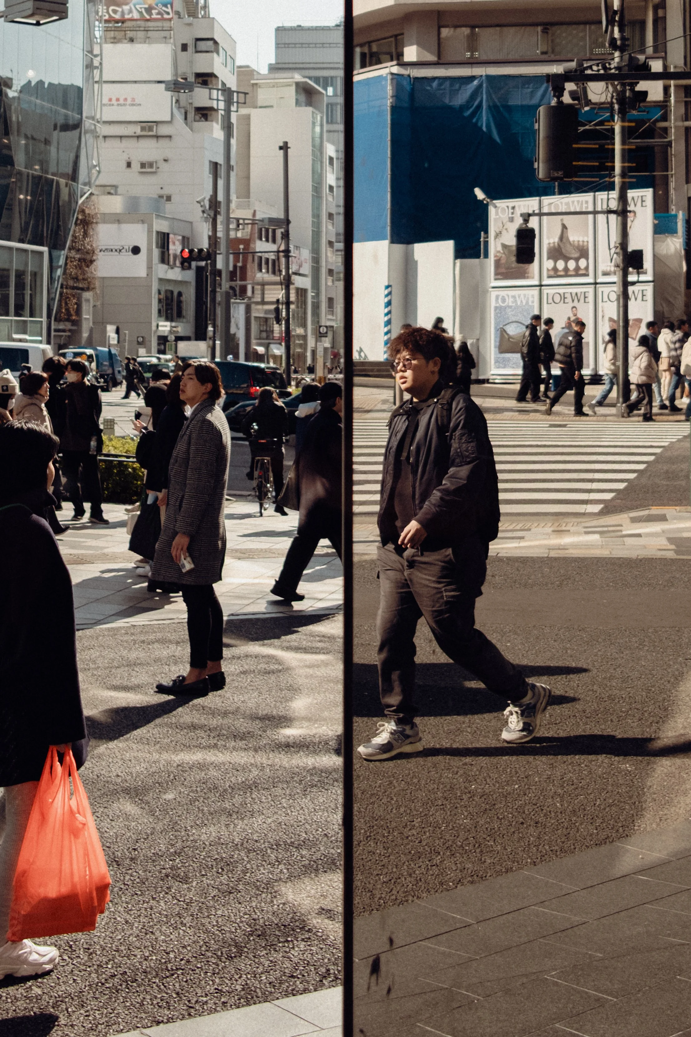 A city street scene divided by a vertical black line. On the left side, pedestrians wait to cross the street, with several women and men in casual to formal attire. In the background, vehicles and tall buildings are visible. On the right side, people