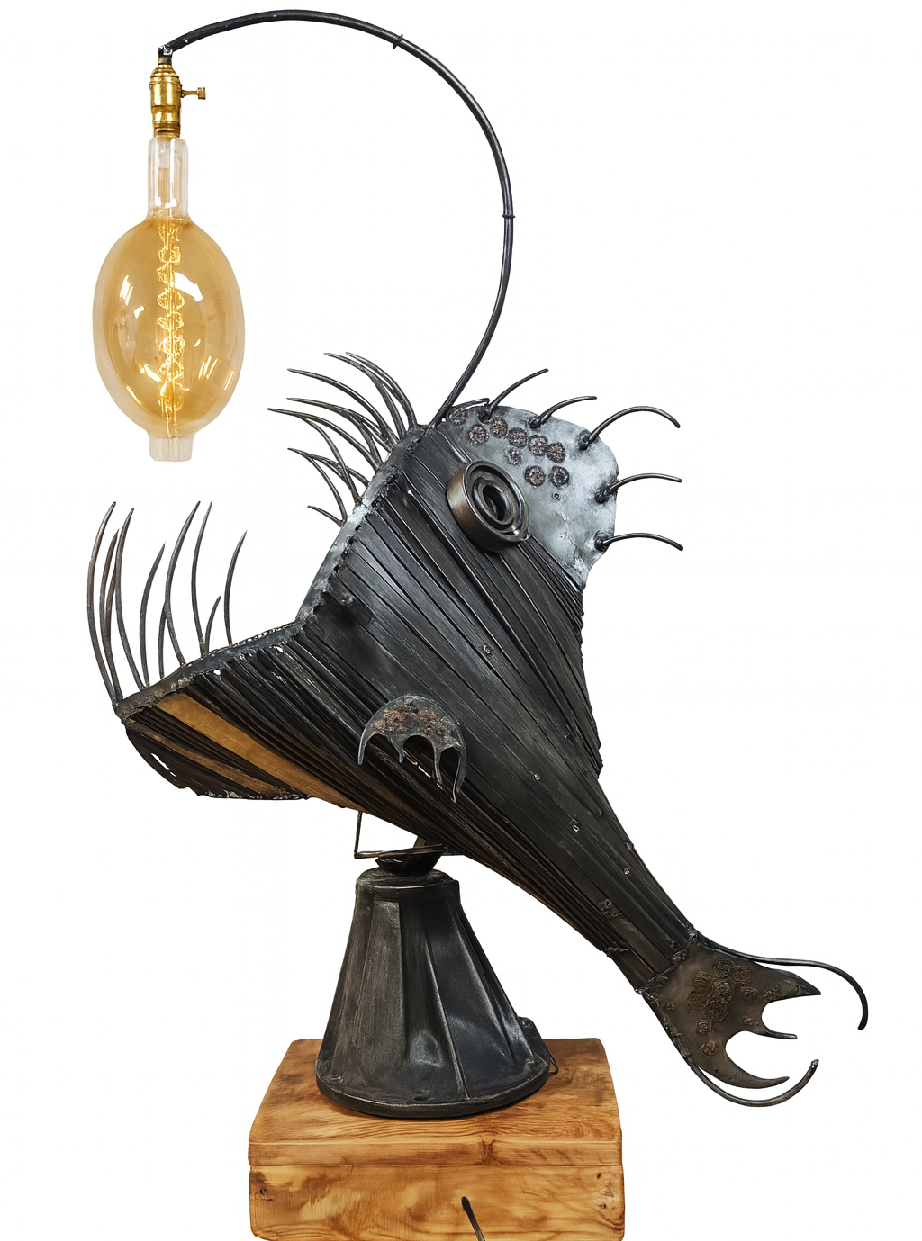 A sculpture of a fish made from metal, with a lightbulb hanging from a wire above it.