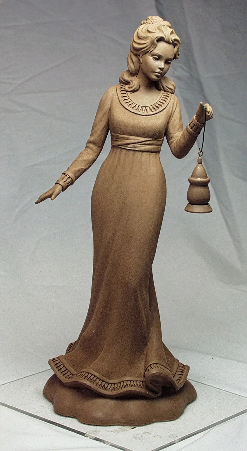 United Design commissioned this figurine, "Hope" in the early 2000s. Vicky sculpted the face while Chuck sculpted the body.