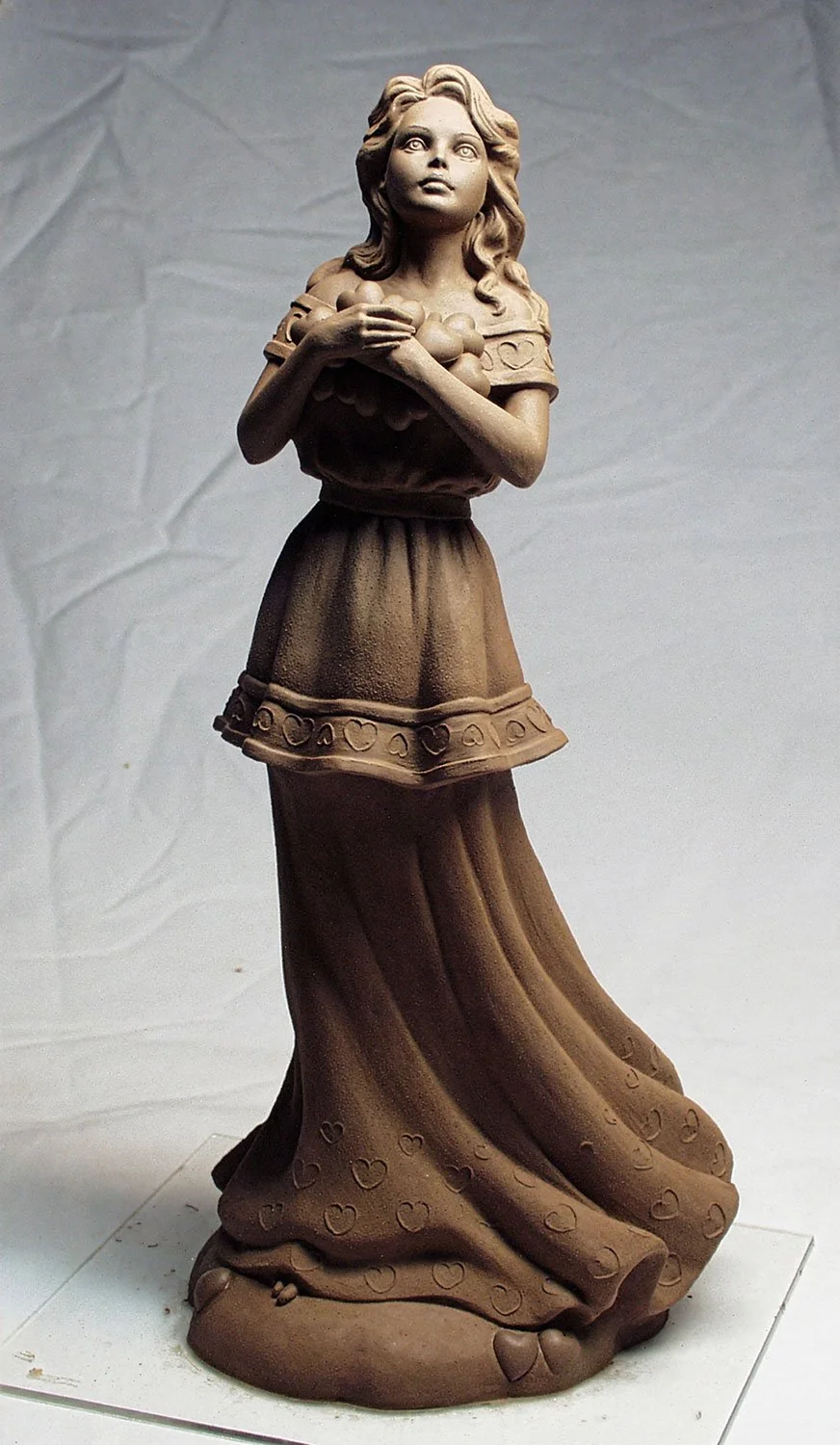 United Design commissioned this figurine, "Love" in the early 2000s. Vicky sculpted the face while Chuck sculpted the body.