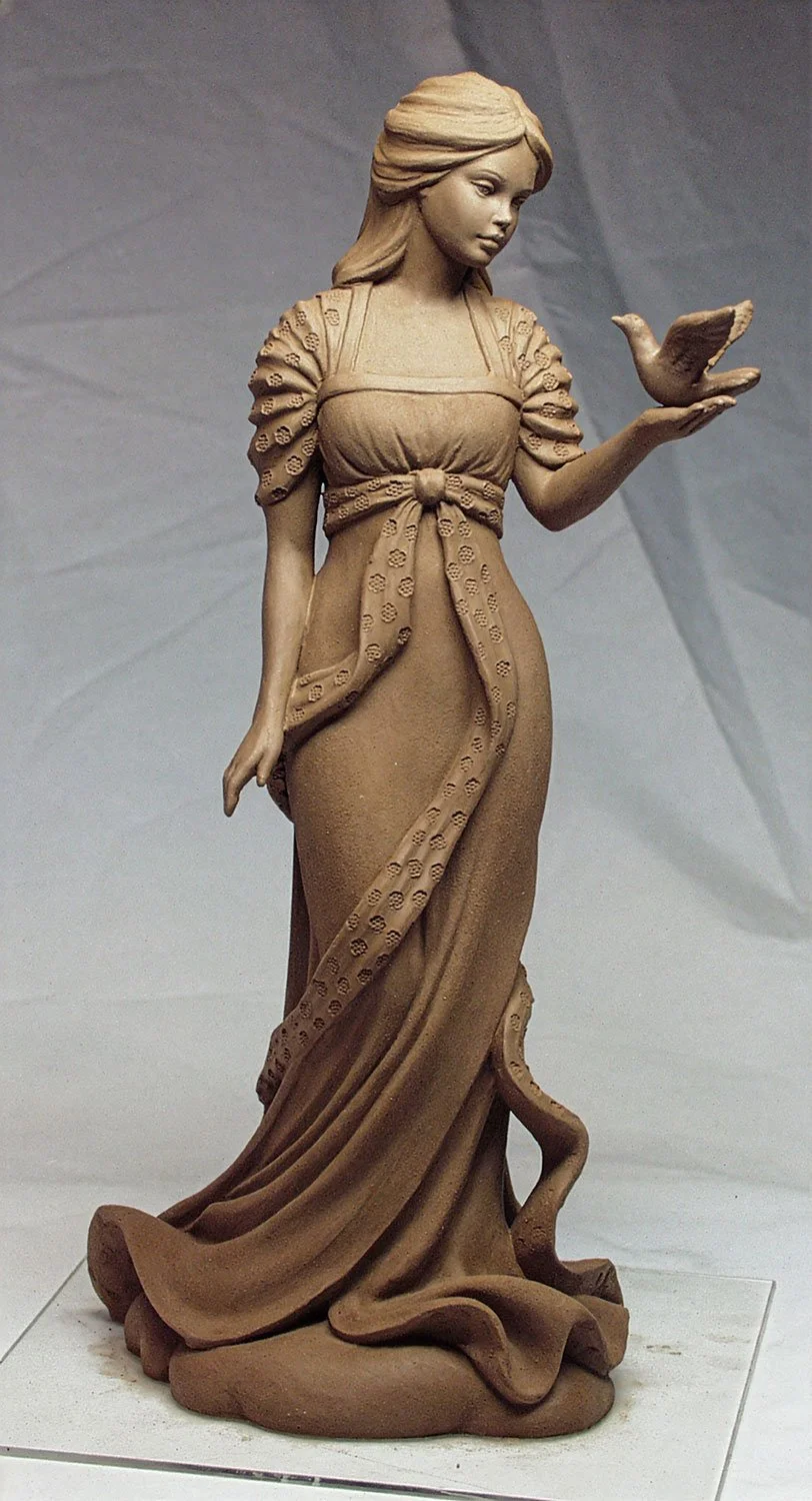 United Design commissioned this figurine, "Peace" in the early 2000s. Vicky sculpted the face while Chuck sculpted the body.