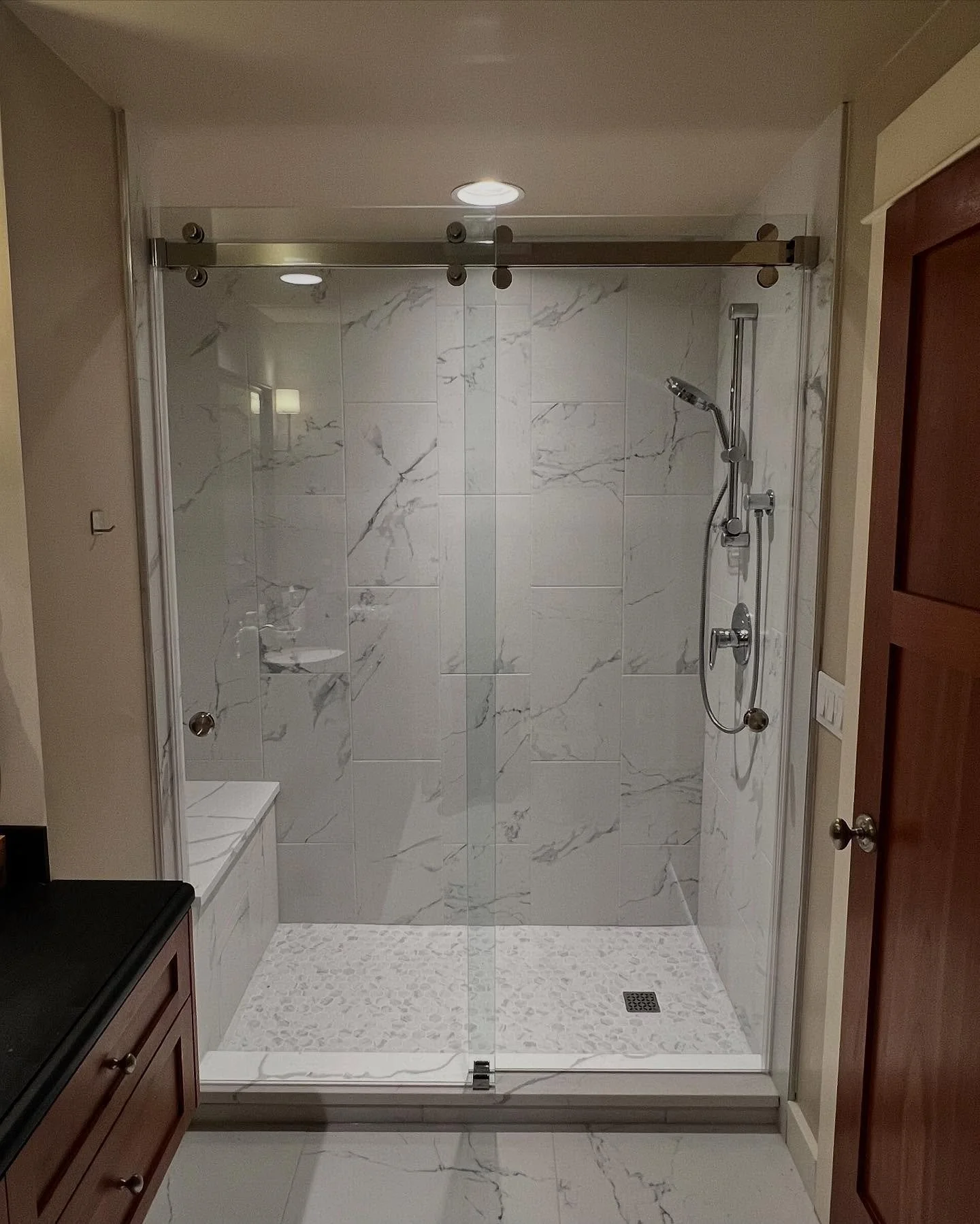 Barn Door Dual Slider with Chrome Hardware. #showerdesign #showerglass #showerglassdoors #showerglassenclosure #barndoors #barndoorslider #chromehardware #barndoorshower