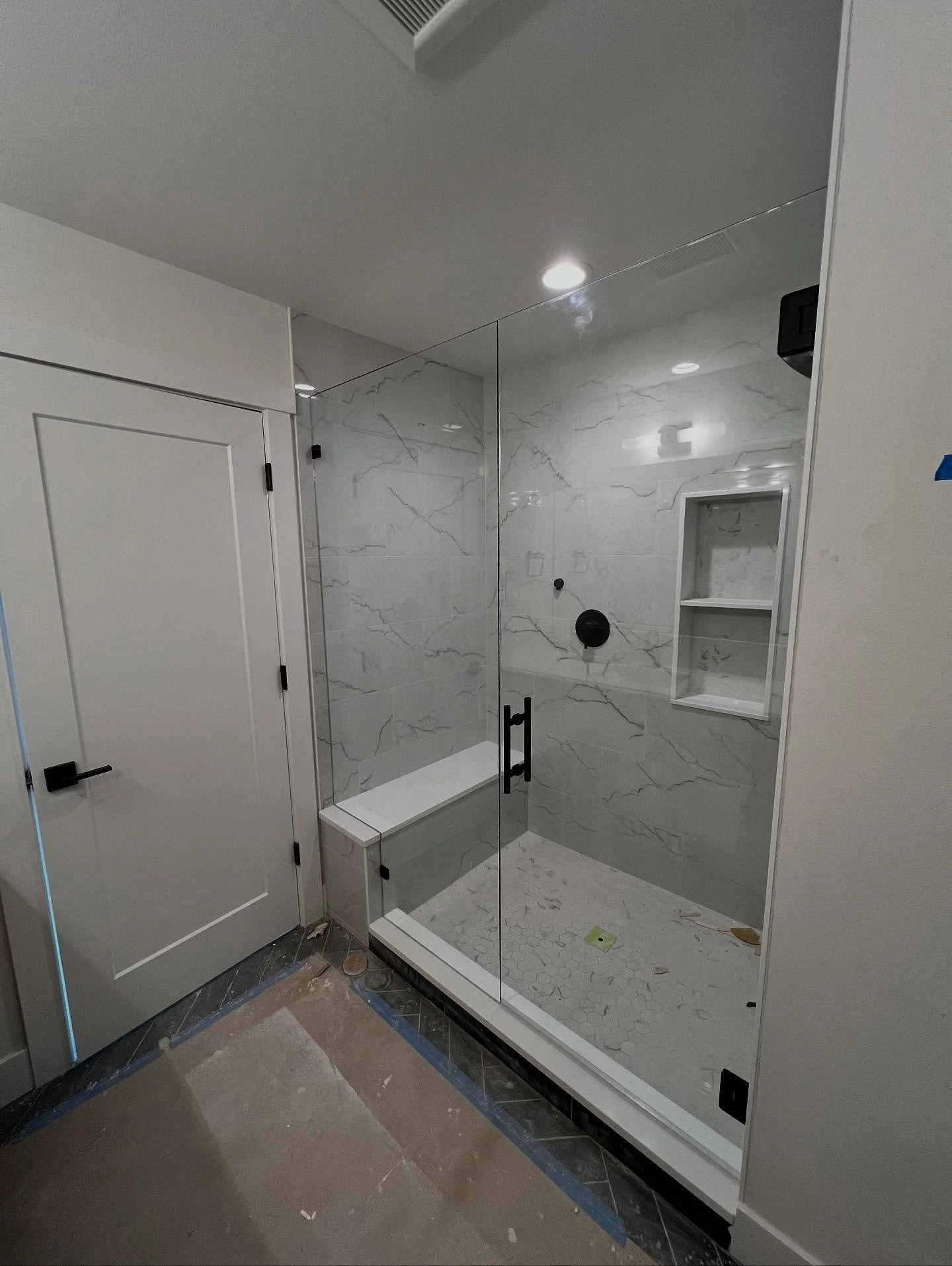 Frameless two panel enclosure with matte black hardware for this custom shower.

#seattleshowerglass #seattleshowerdoor #seattleglass #seattleglasscompany #showerglass #framelessshower