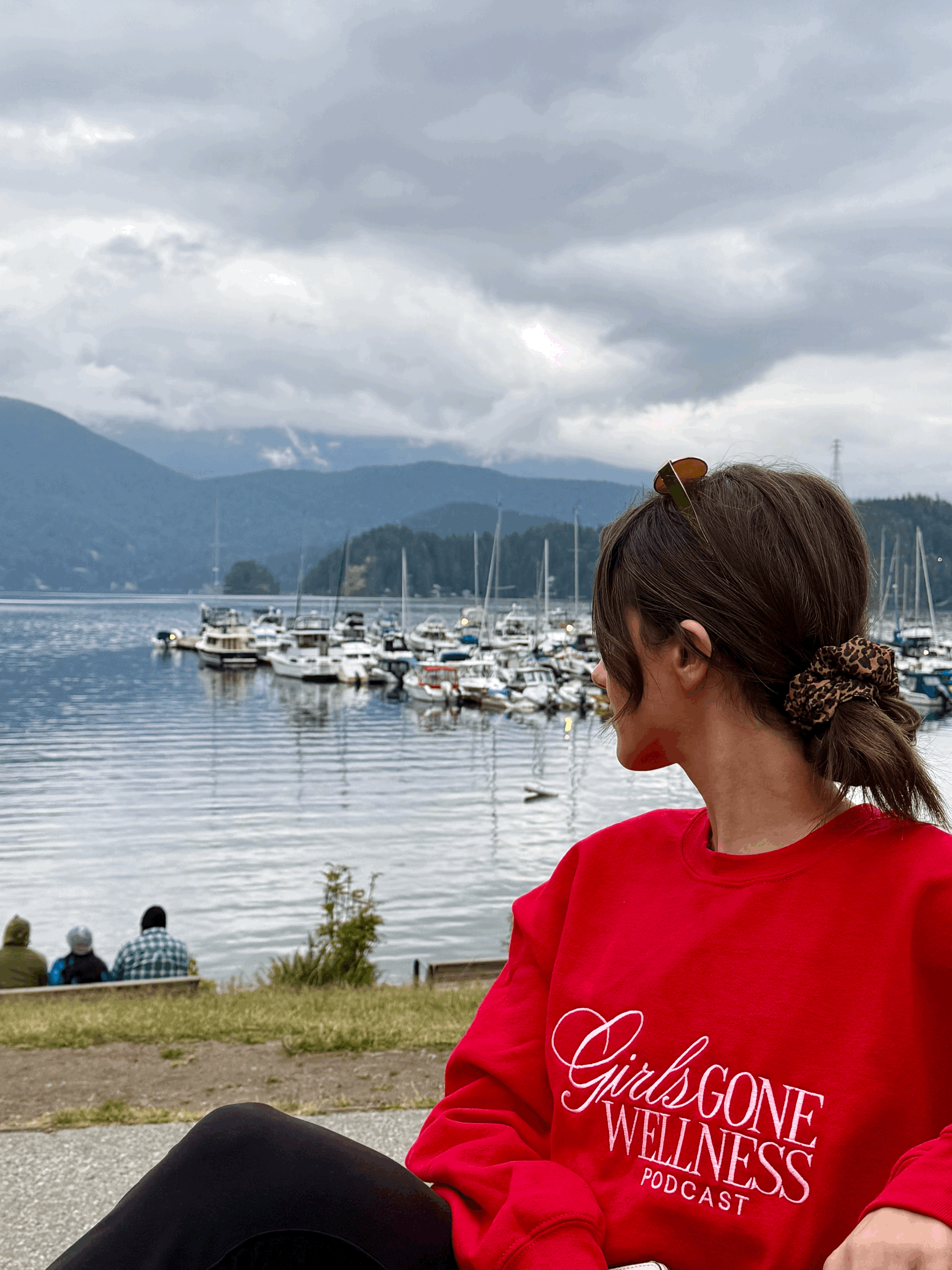 girl wearing red wellness crewneck