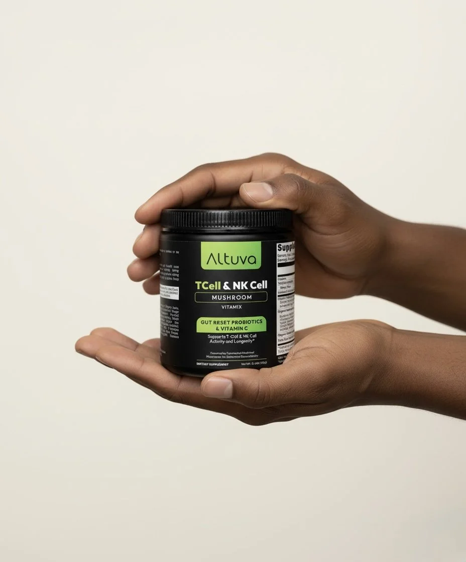 A person's hand holds a black jar of Altuva TCell & NK Cell Mushroom Vitamix supplement with green, black, and white labels.