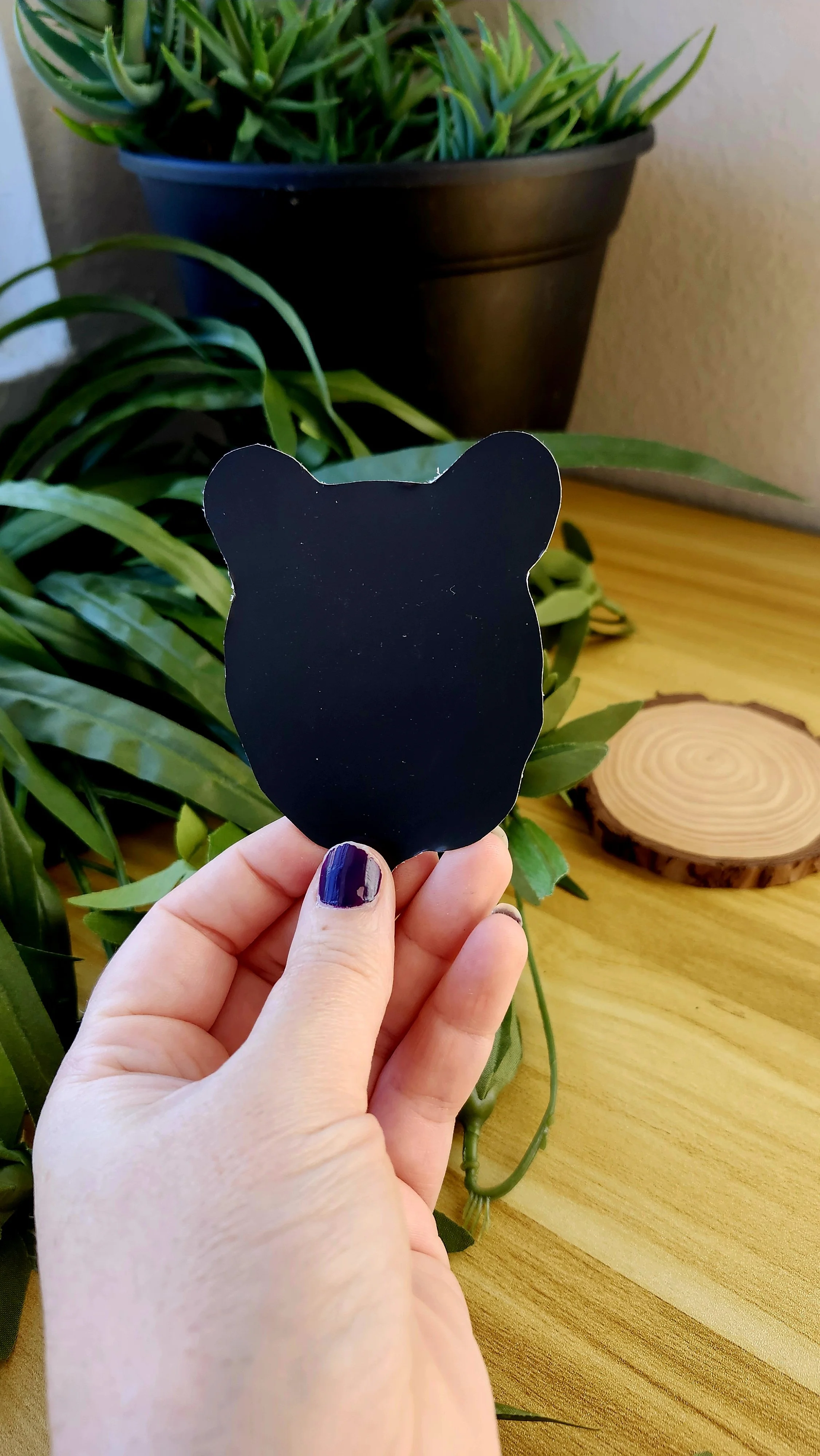 back of black bear face magnet showing magnetic backing