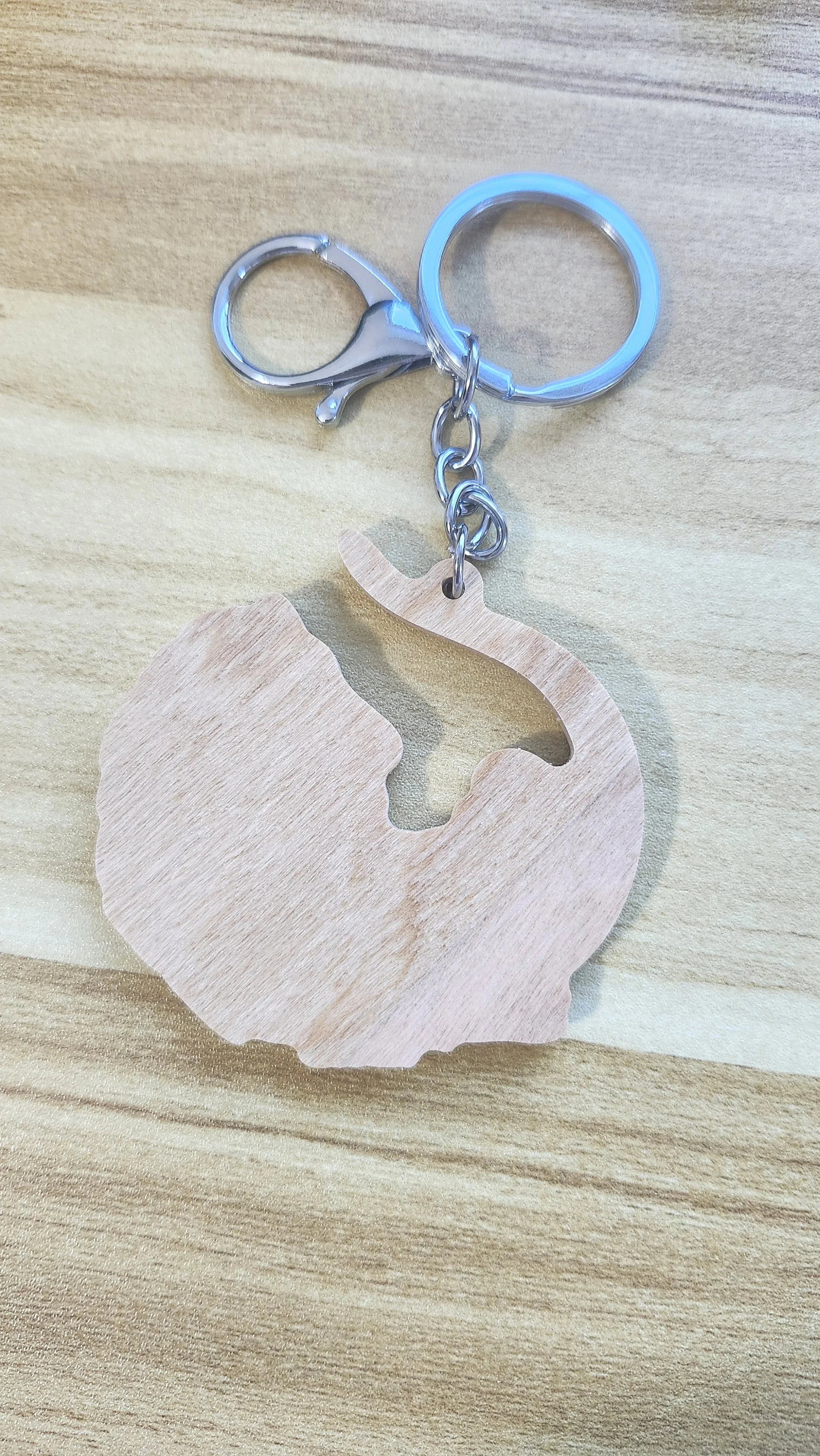 plain wooden back of wooden opossum keychain