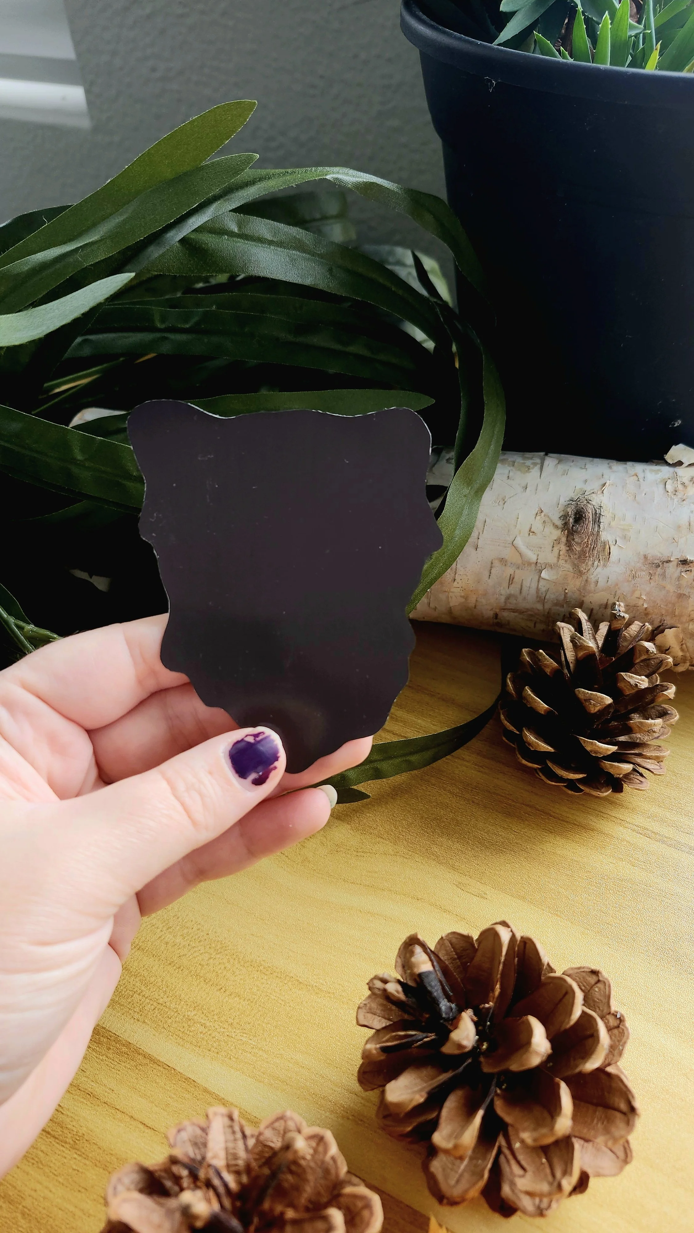 back of red panda face magnet showing magnetic backing