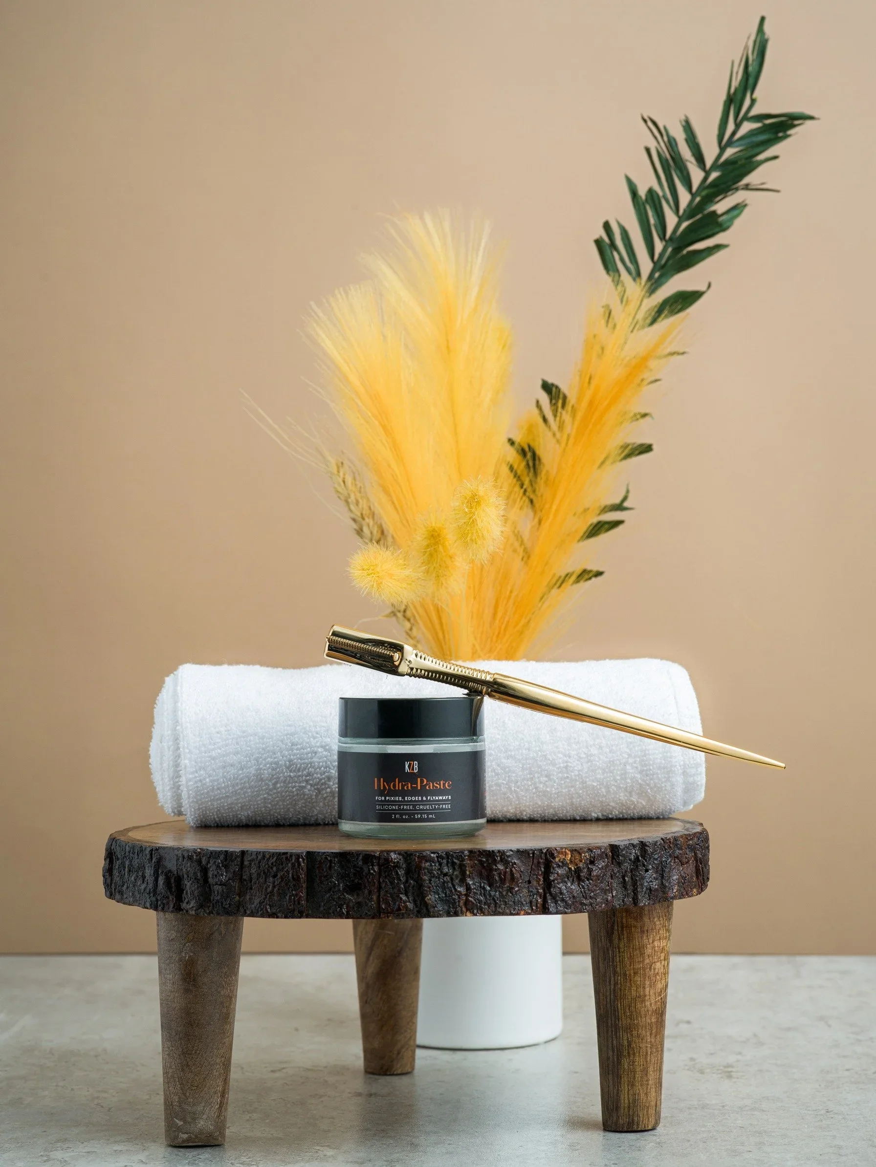 Hydra-Paste: 

A versatile pomade formulated just for relaxed and chemically treated hair. Packed with ceramides, moisture, and hold to protect and groom beautiful pixies, ponytails, wigs, weaves, and edges