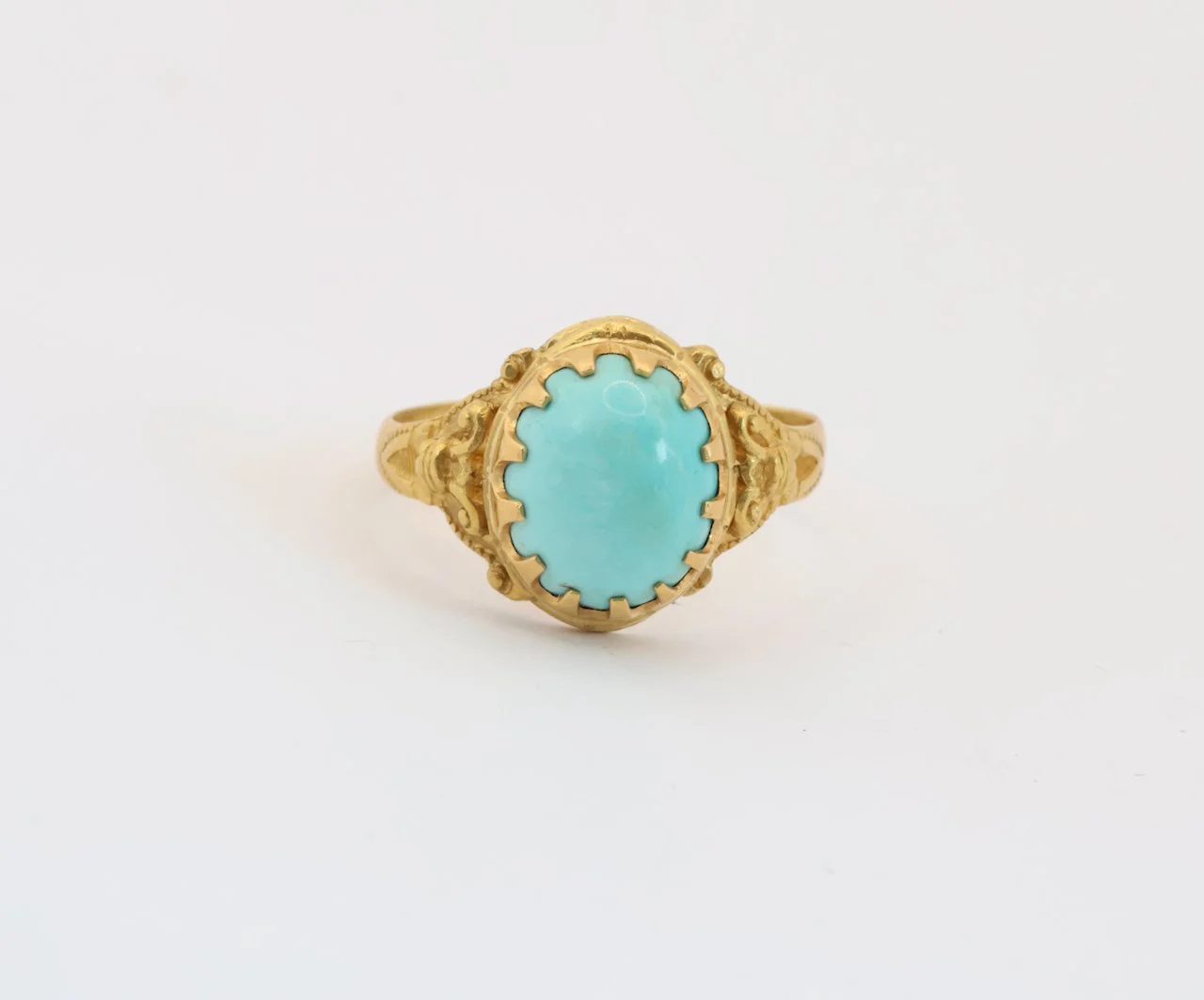 Turquoise set in 23ct Gold