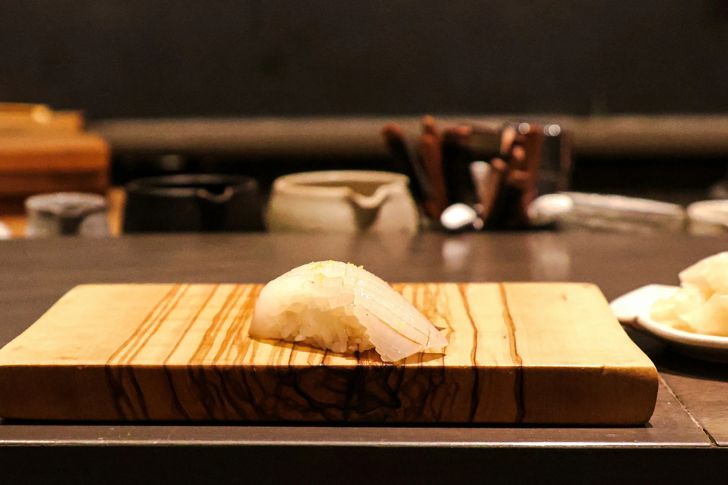 Omakase dining experience in Japan with chef-prepared sushi at a traditional counter