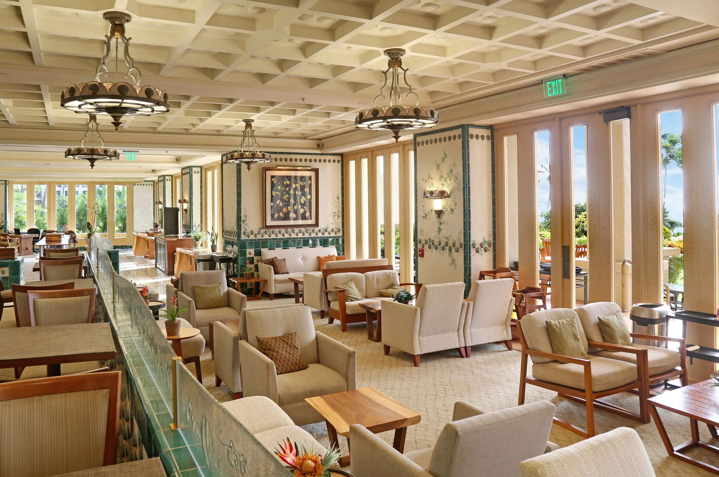 Grand Club lounge at Grand Hyatt Kauai Resort & Spa featuring elegant seating, tropical décor, and oceanfront views in Poipu, Kauai.