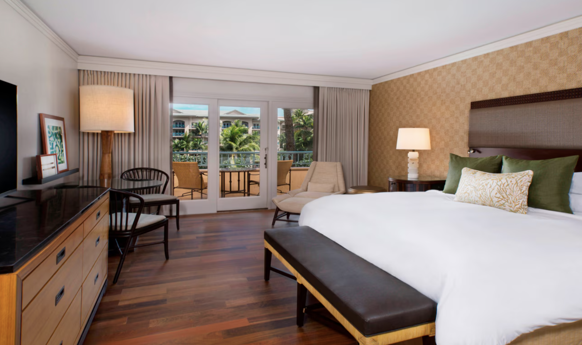 Guest room at The Ritz-Carlton Kapalua with private balcony, tropical views, and elegant island-inspired design in Maui, Hawaii