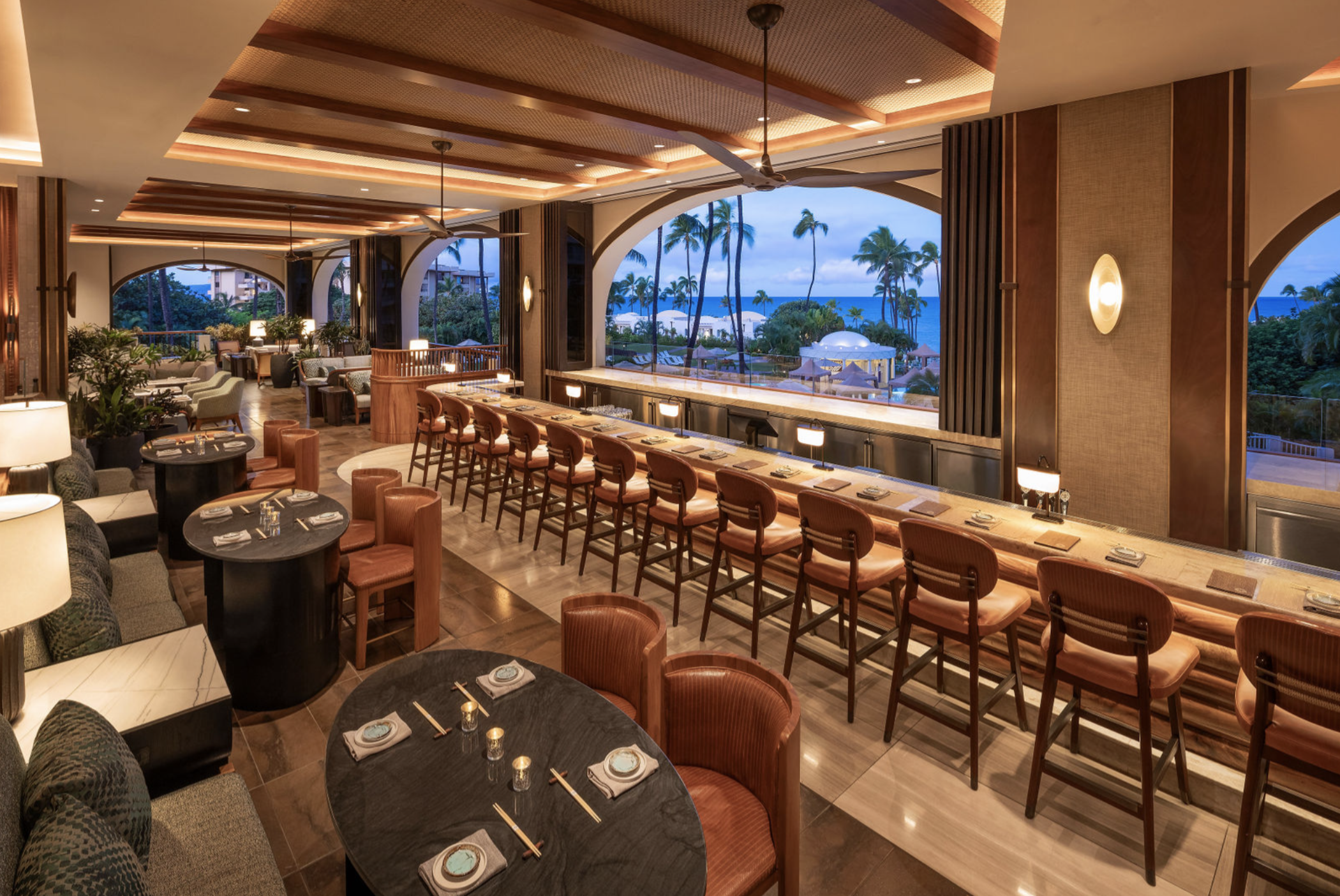 Pilina restaurant at Fairmont Kea Lani Maui with ocean views, open-air dining, and elegant bar seating