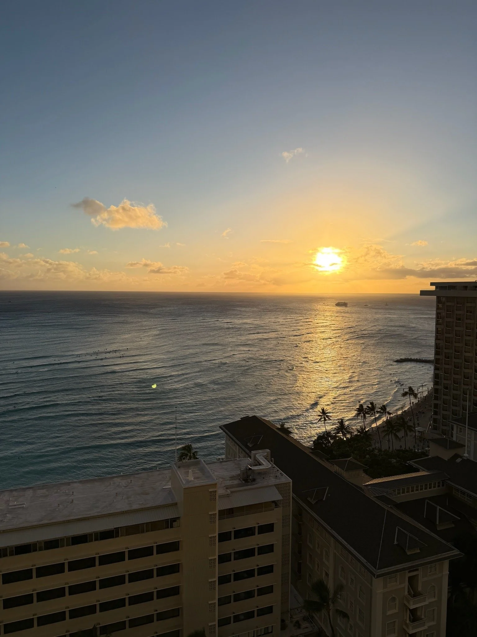 Sunset view over Waikiki Beach and the Pacific Ocean from a partial ocean view room at Hyatt Regency Waikiki Beach Resort & Spa in Honolulu, Oahu, Hawaii.