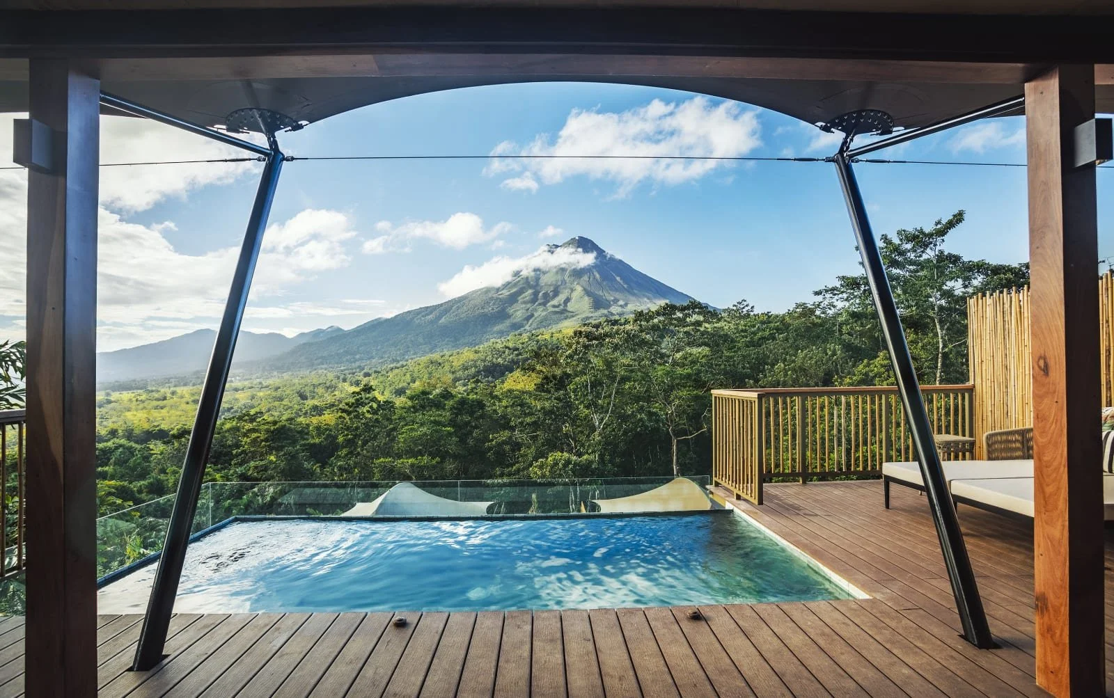 Private plunge pool and expansive rainforest views overlooking Arenal Volcano at Nayara Tented Camp in Costa Rica
