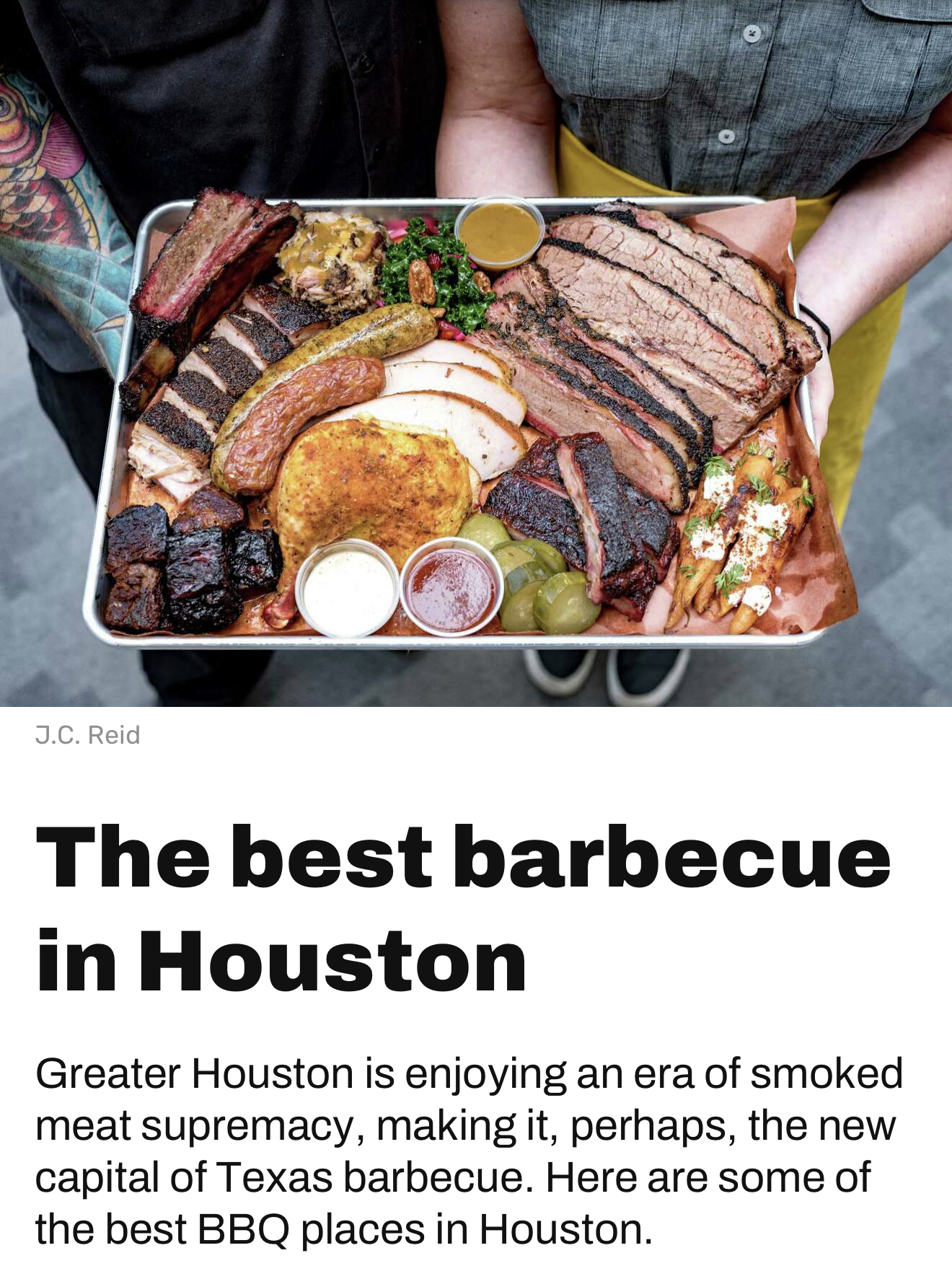 A tray filled with various types of smoked and grilled meats, including brisket, sausage, chicken, ribs, and other BBQ items, accompanied by small containers of sauces, pickles, and side dishes.
