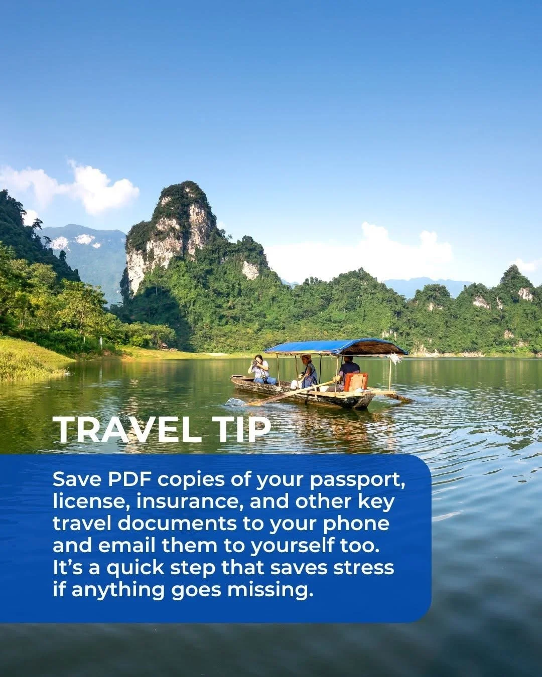 A scenic river with three people on a small boat with a blue canopy, surrounded by lush green mountains and a clear blue sky.