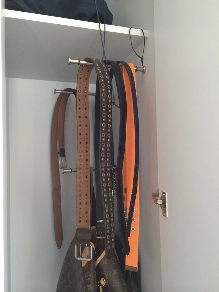 Red illuminated chair with gold accents and a separate curved red piece, set against a plain gray background.