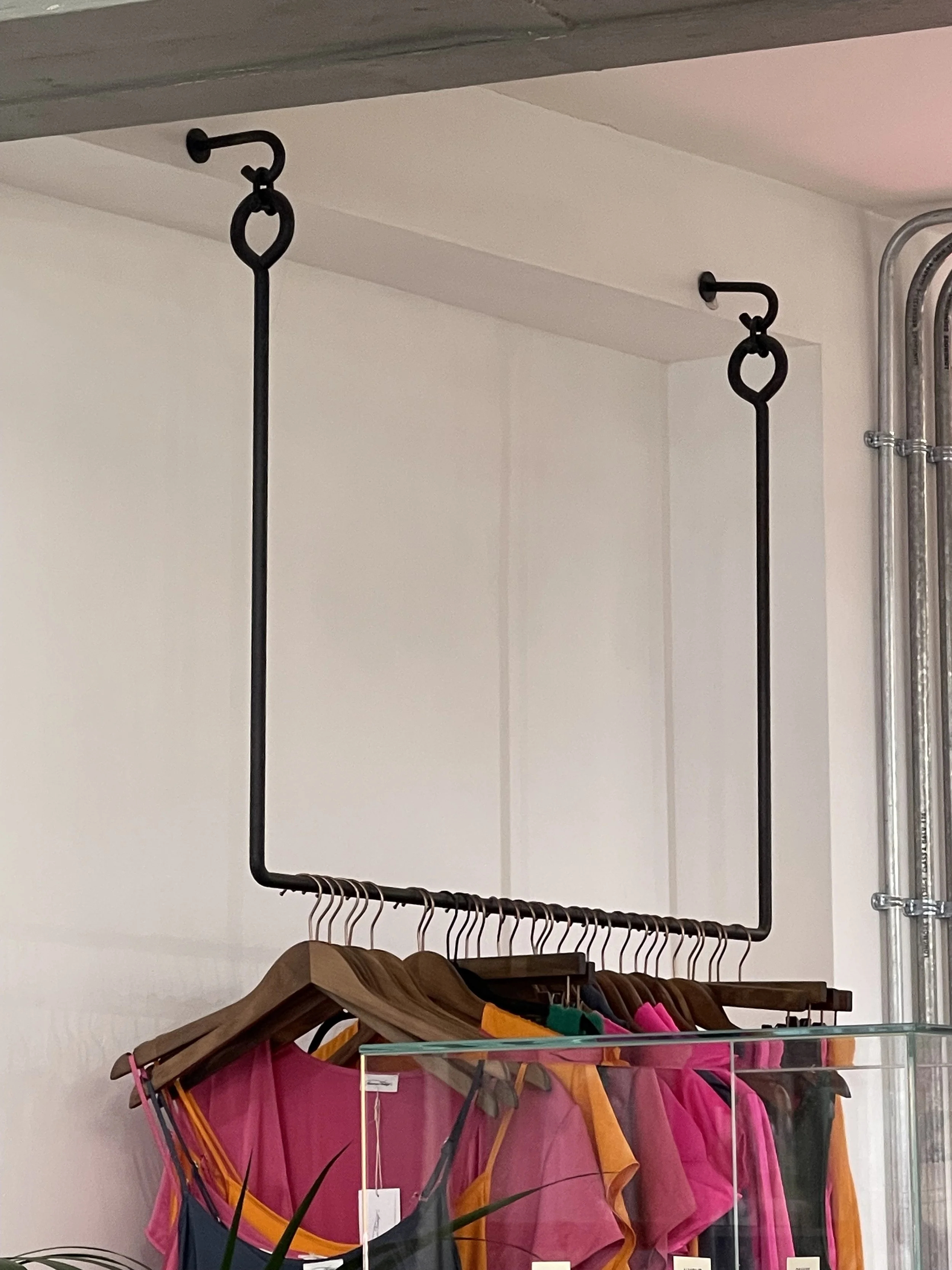 Red wooden chair with gold accents and a matching small table against a gray background