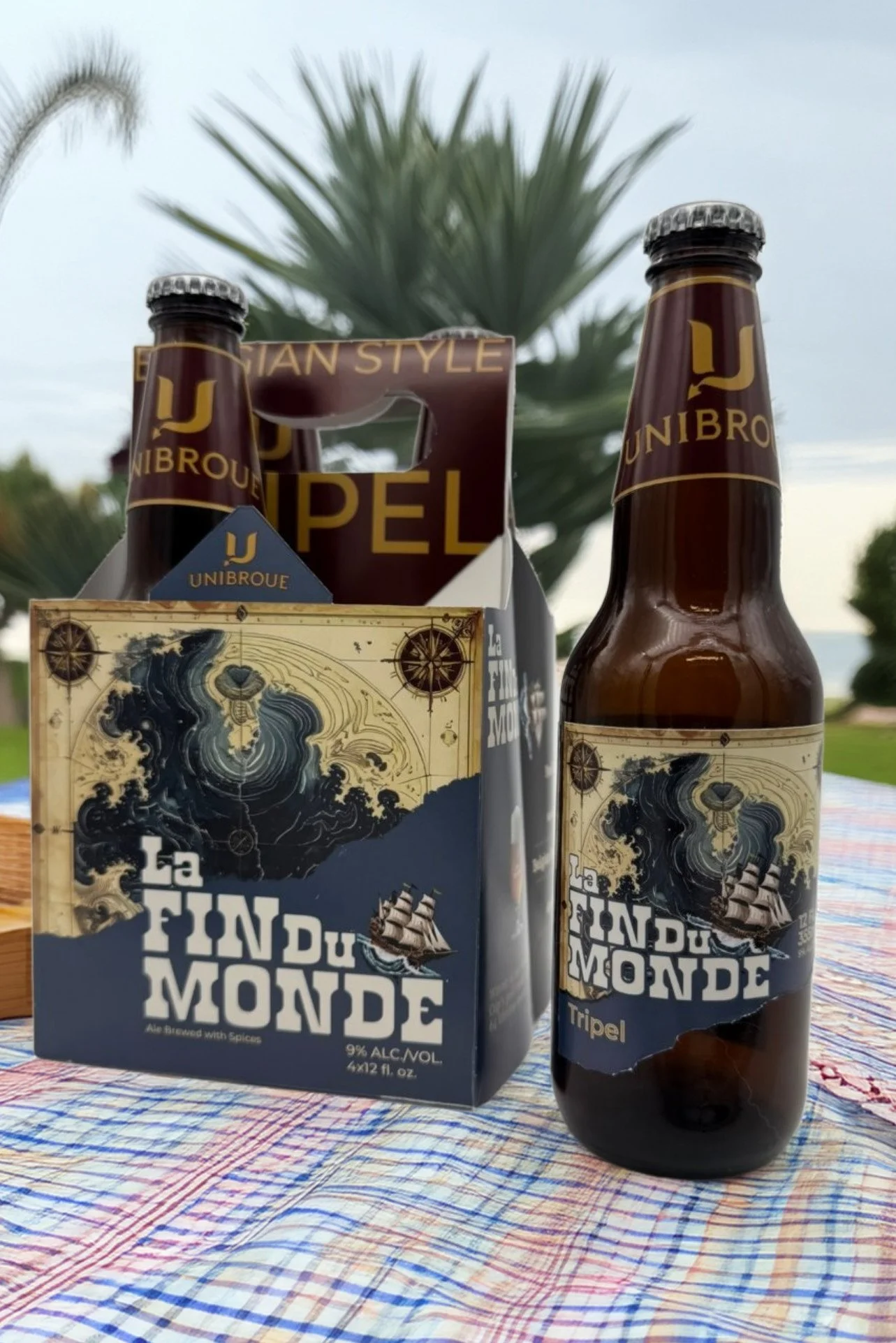 Beer on table in front of palm tree