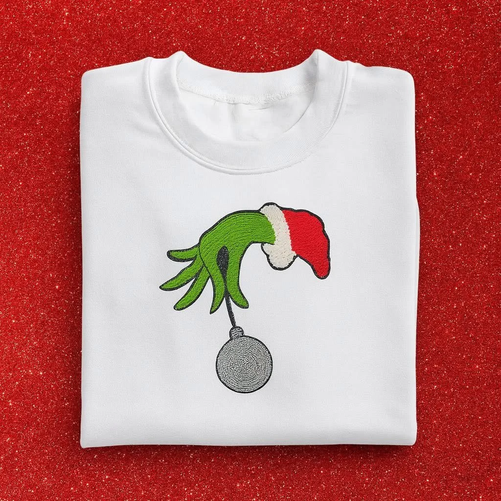 fluffy chenille grinch hand with rhinestone red bulb -crewneck $32
