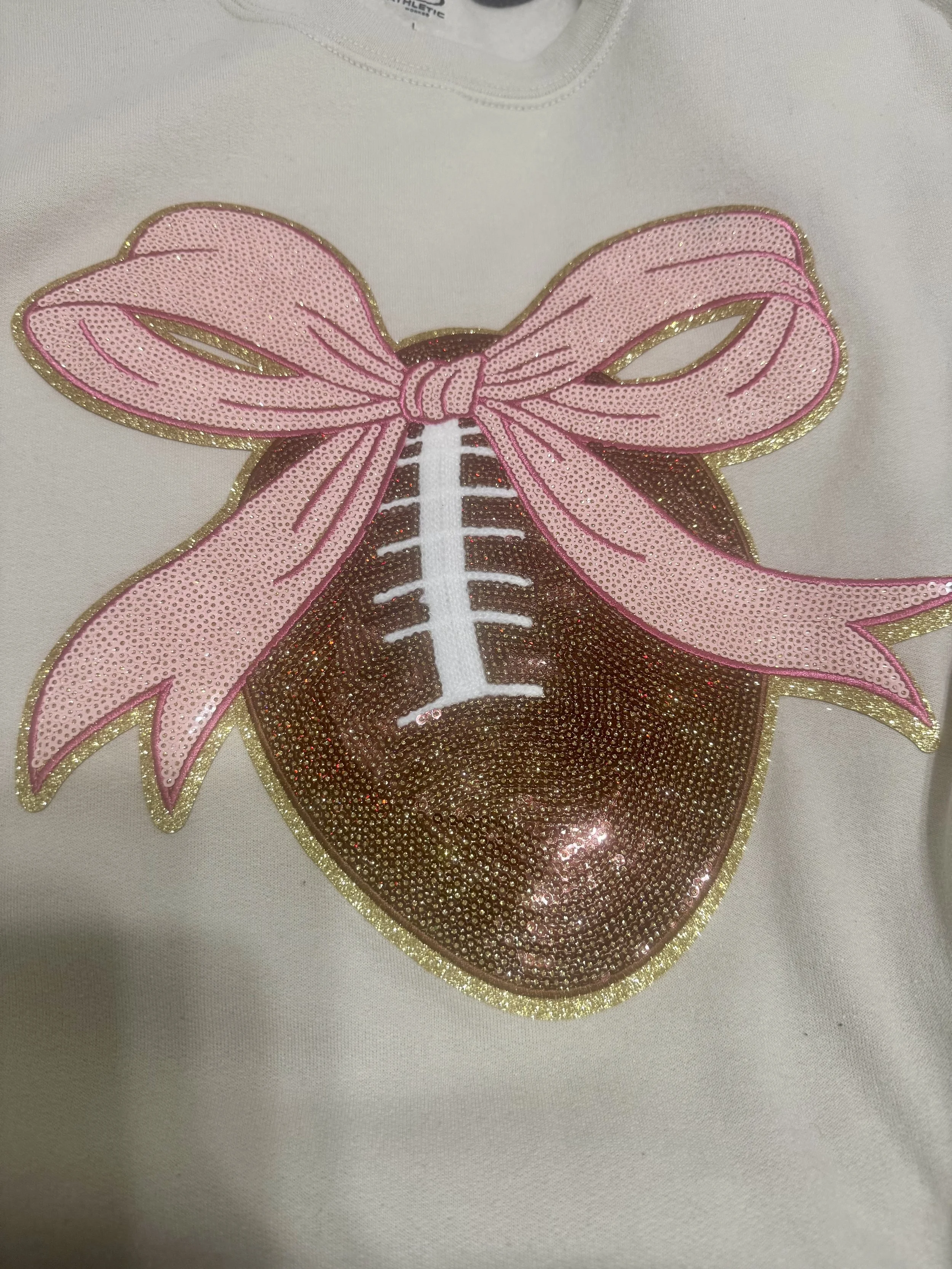 Sequin Beaded Bow Football - Sweatshirt $40