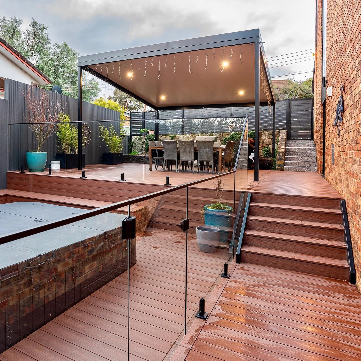 Loving how this epic 200m&sup2; entertainment space came together in McKellar &mdash; finished with Designer Series #Ekodeck, a sleek @stratcoaustralia Outback Cooldek pergola, and complete with a swim spa. Built for comfort, style, and serious outdo