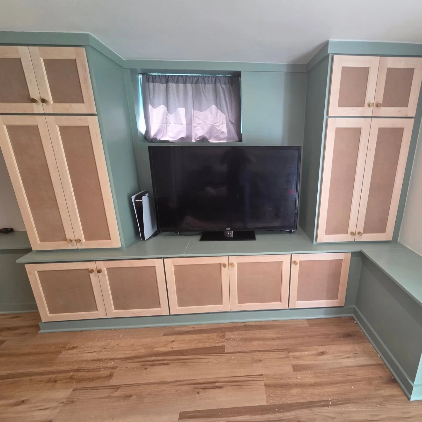 New custom made doors installed with new self closing hinges and brass knobs. Ready for paint to match the custom built in.  #built ins #carpenter