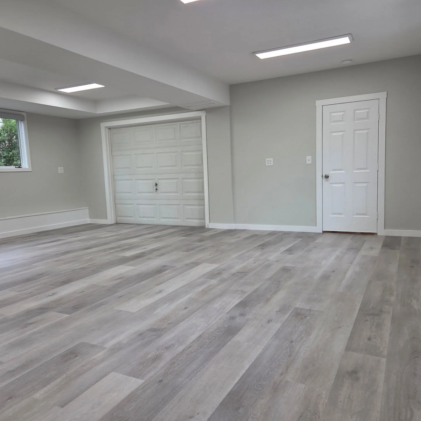Recreational room/game room remodeled with #viynl plank flooring, #benjamin moore paint and electric flat panel lighting. Check out before pics to see what a transformation was made. #lifeproofflooring #patriot lighting