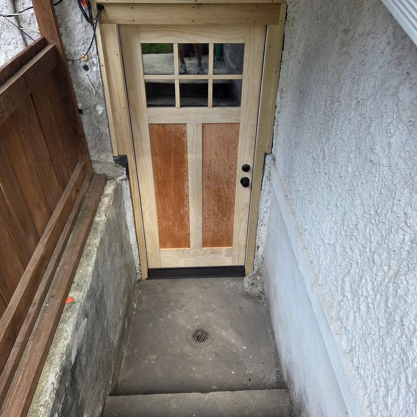 Basement exterior door custom made to fit. Jamb, trim, and threshold built to fit door.  Check out before pic to see what a transformation was made. #exteriordoor #carpentry