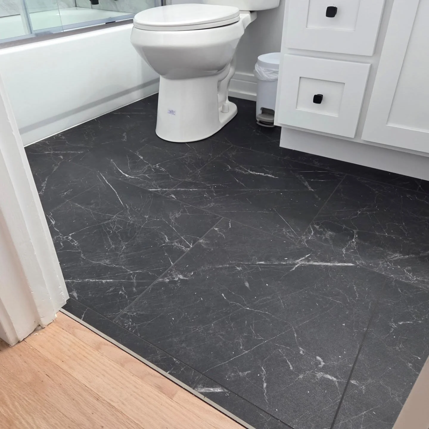 Are you buying a new house and want to add your personal touches. Here's a punch list just finished. Tvs mounted, vinyl plank bathroom floor installed and new hardware installed in all bathrooms. To finish the list off a bedroom painted in #nurserypi