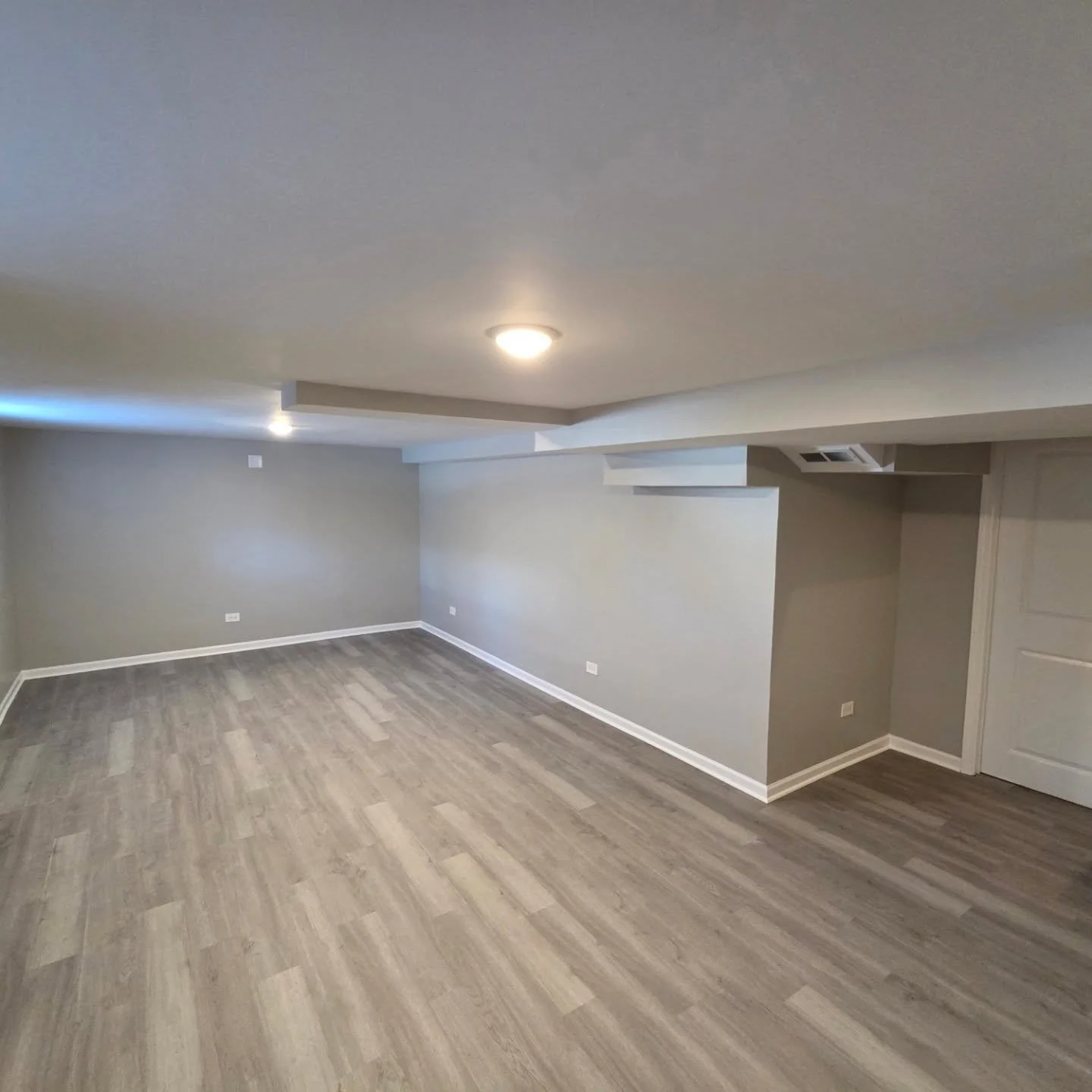 Basement renovation due to flood damage. New drywall, viynl plank flooring and baseboards.