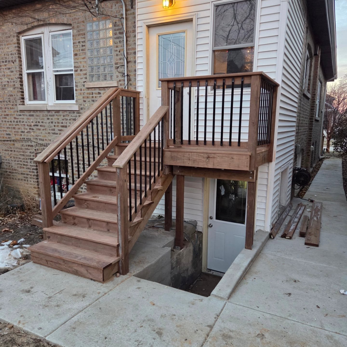 Last deck of the season.  Cedartone deck with access to basement.  New concrete sidewalk and stairs. New basement door installed. #deckbuilding #carpentry