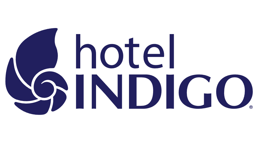 Hotel Indigo logo featuring a navy blue stylized plant or sea shell graphic next to the text 'hotel INDIGO' in navy blue letters.