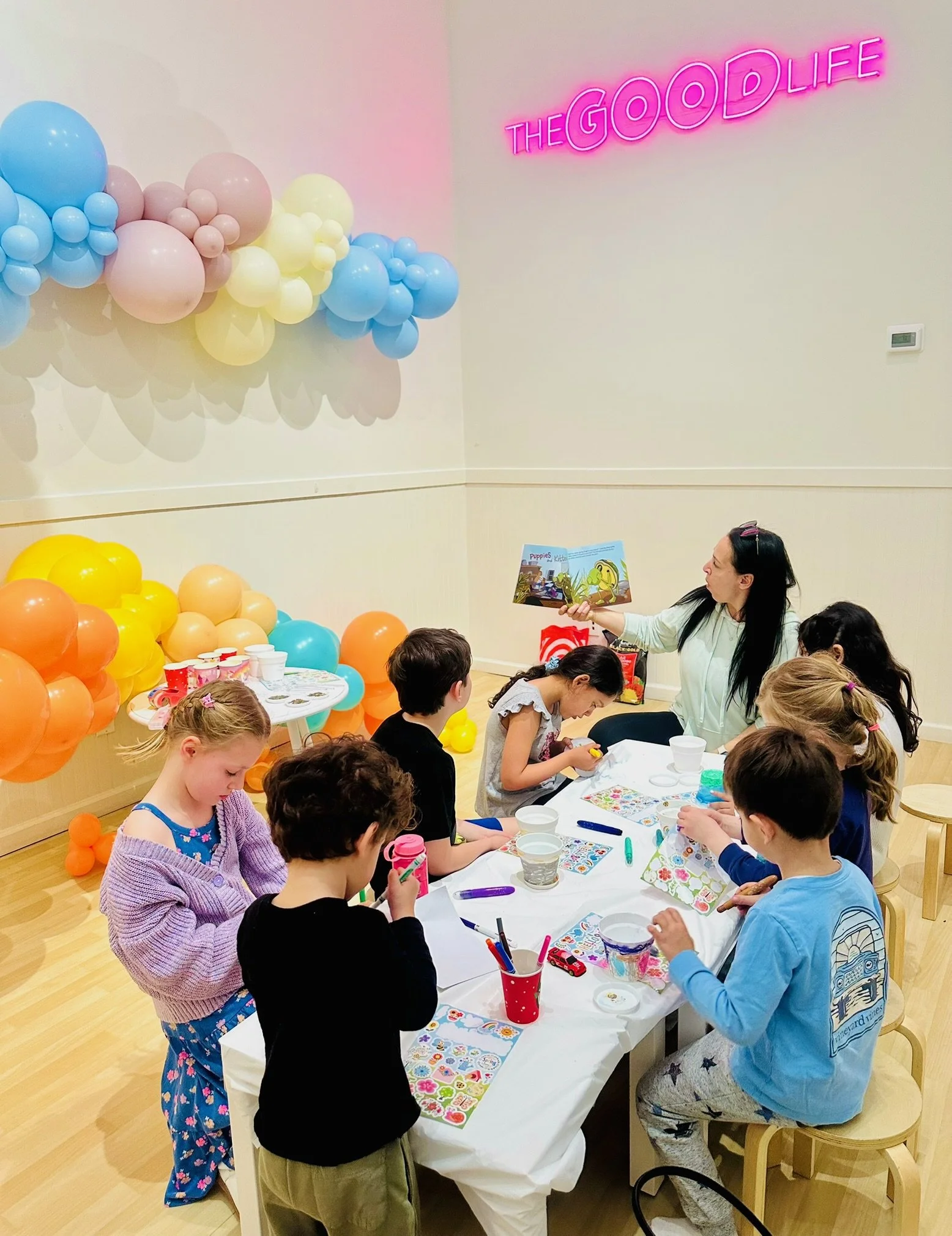 Group of kids doing an art project with My Two Homes at Oh My Goodness in Port Washington