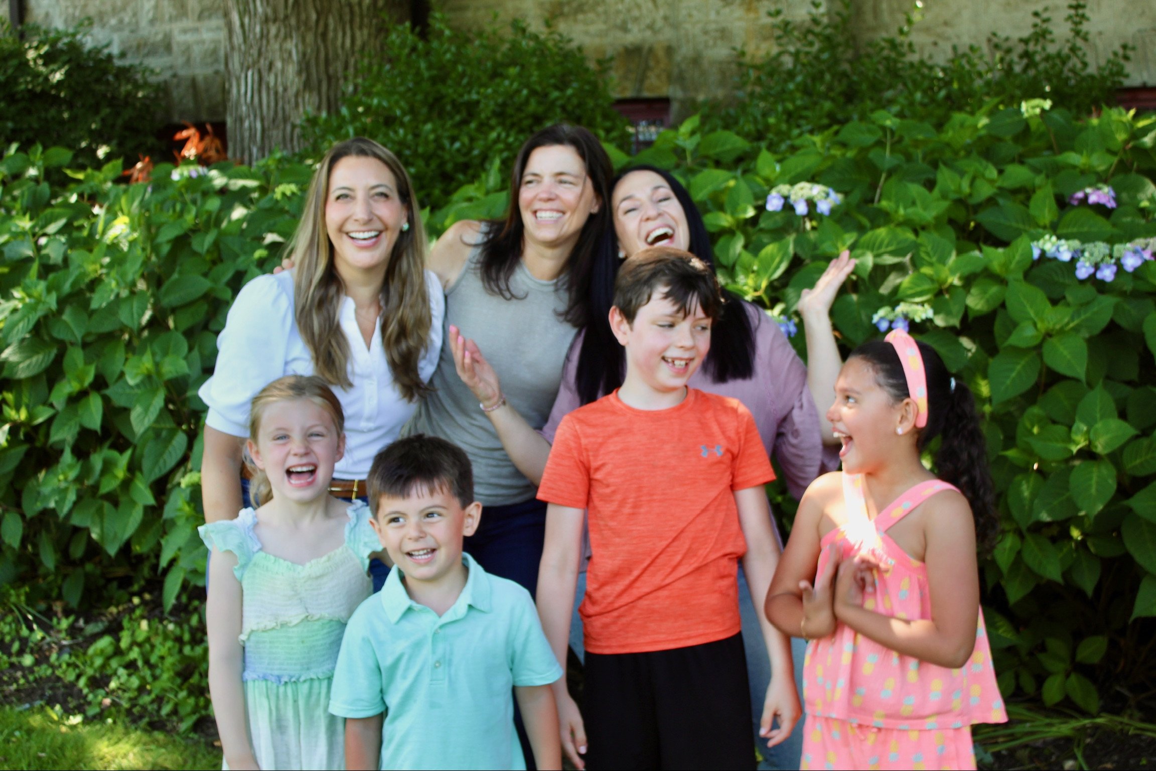 My Two Homes Group laughing together at a local park in Port Washington